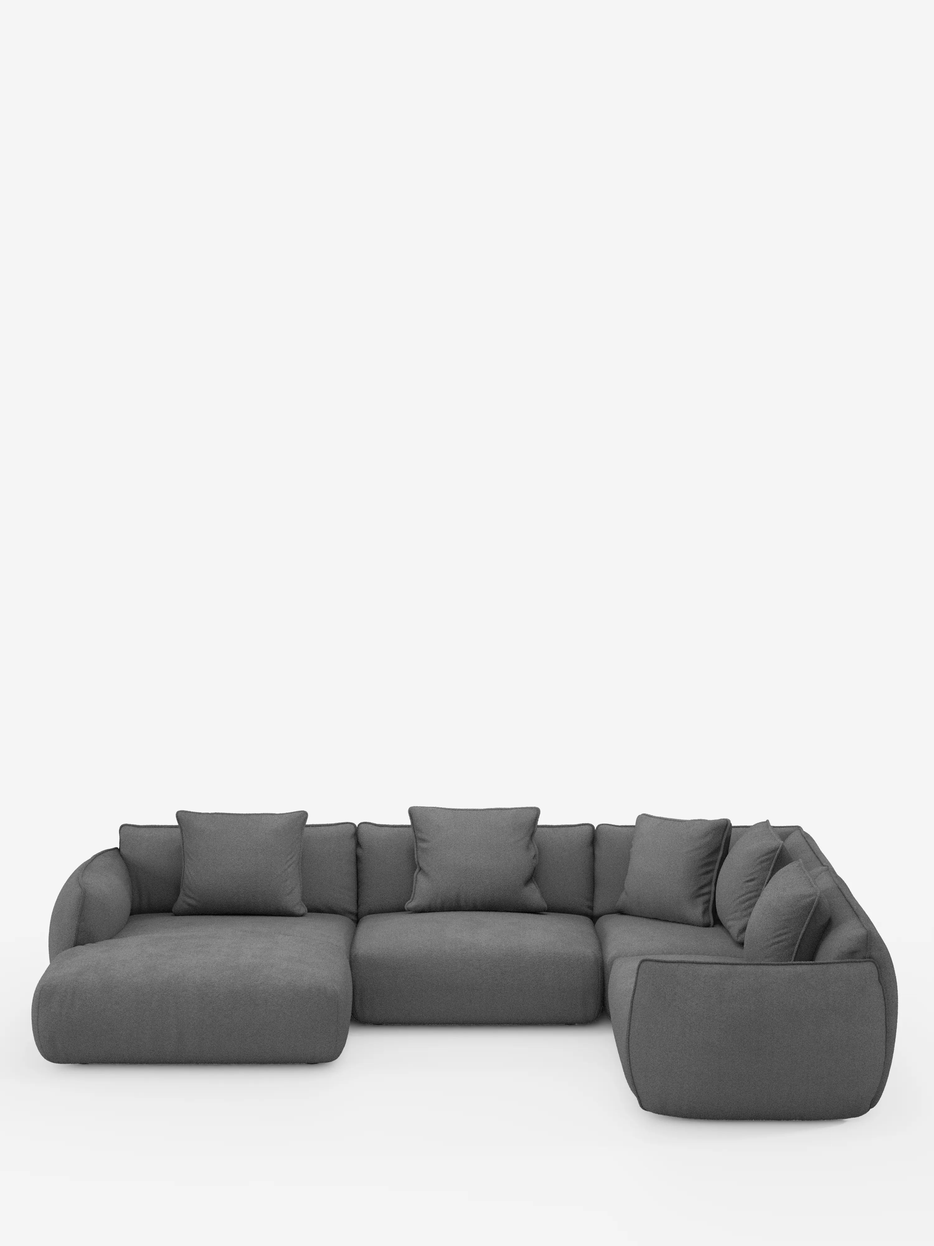 Un divano angolare panoramico componibile Nimbus, moderno e minimalista, con penisola e angolo in tessuto smacchiabile T33 di Divani.Store, rivestito in grigio scuro, caratterizzato da morbidi cuscini e braccioli. Questo divano modulare a forma di L, di produzione italiana, è composto da tre sezioni di seduta ed è impreziosito da sette cuscini decorativi coordinati, il tutto su uno sfondo bianco a tinta unita.