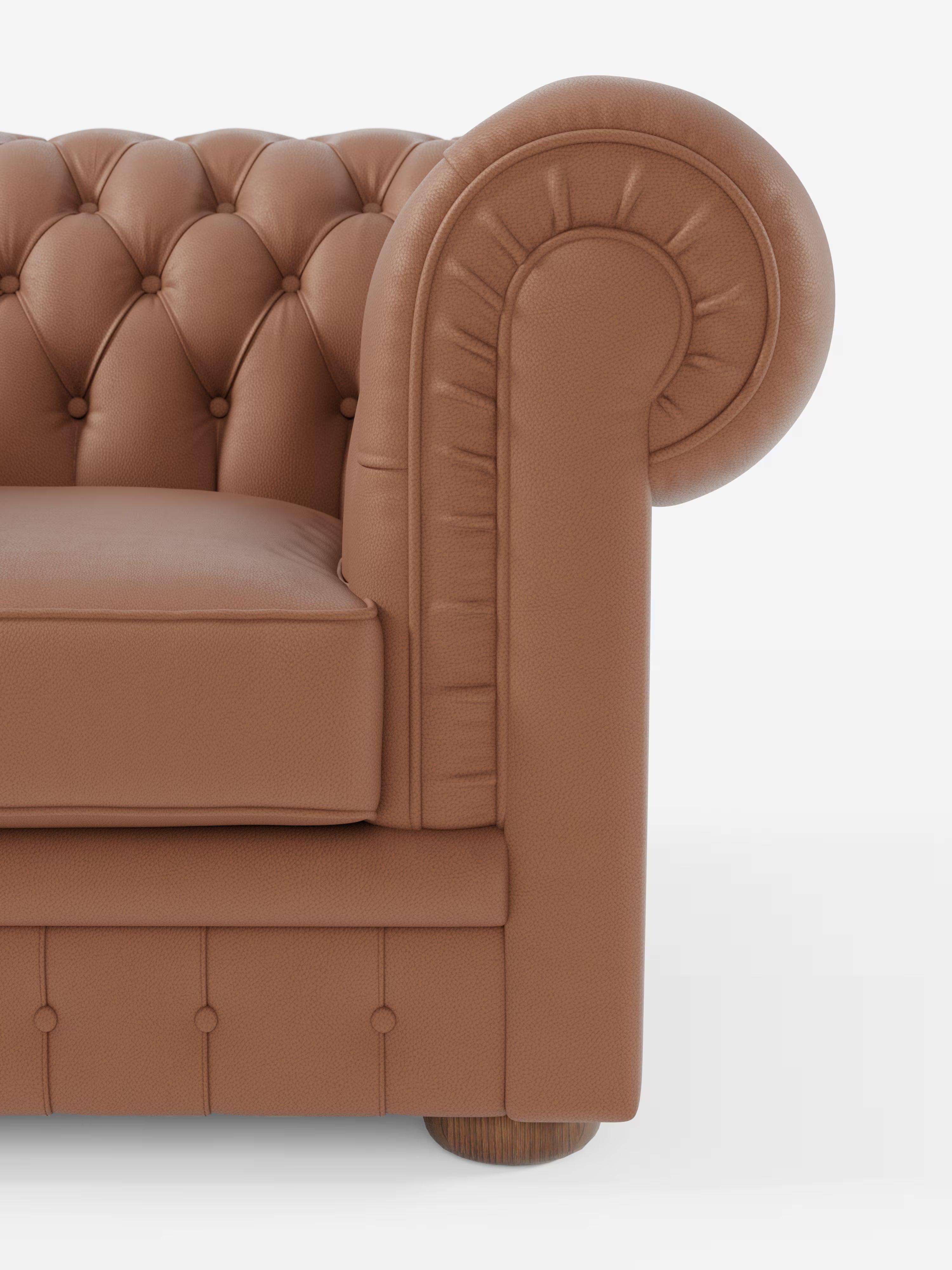 Primo piano della poltrona Chester in vera pelle spessorata con capitonné artigianale di Divani.Store, che mette in risalto il bracciolo in pelle marrone con profonda trapuntatura a bottoni, il cuscino quadrato e il piedino rotondo in legno. Realizzato in vera pelle di prima qualità, il bracciolo arrotondato presenta cuciture a vista che ne accentuano la lavorazione artigianale. Lo sfondo è bianco a tinta unita.