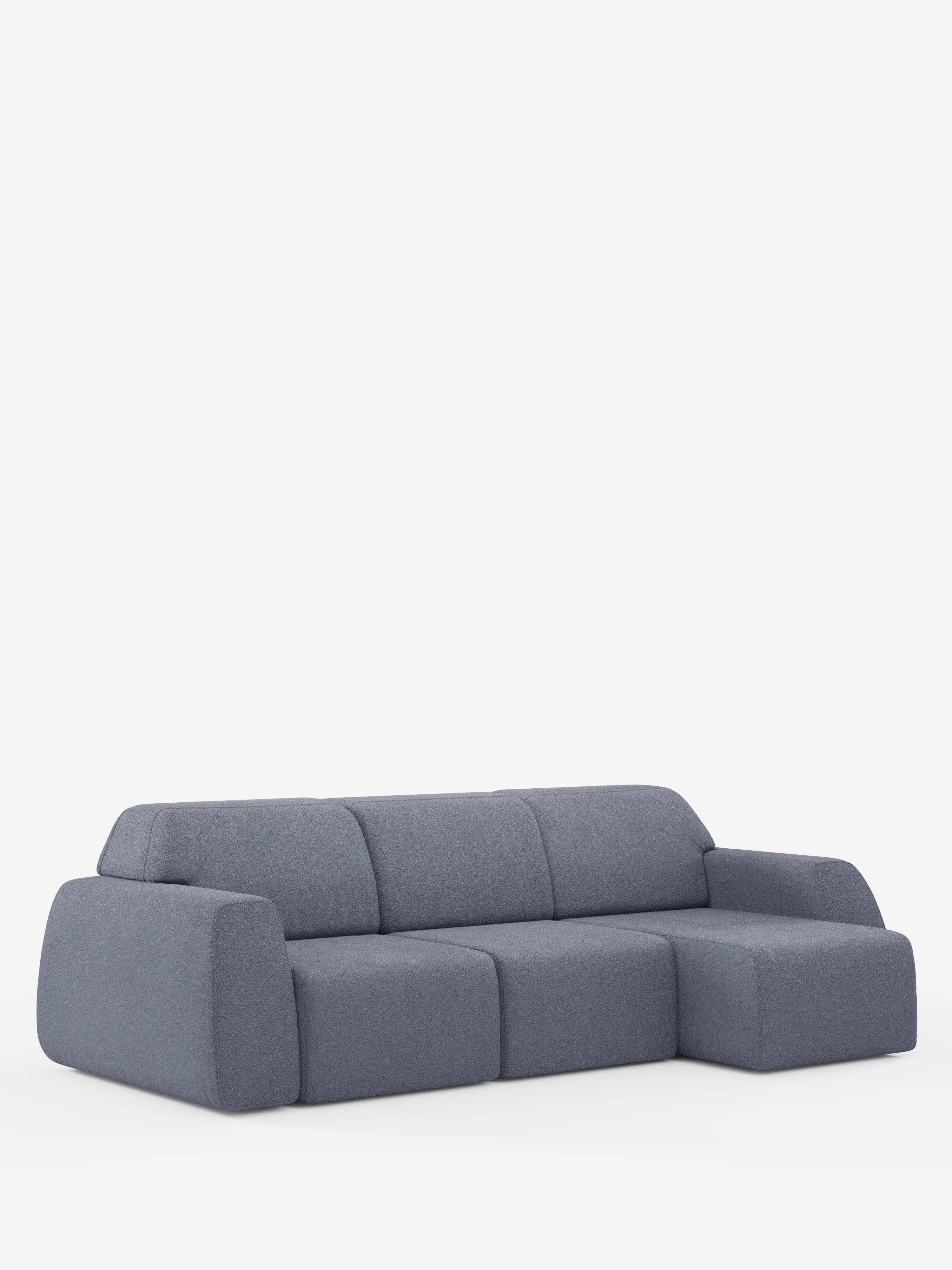 Un divano componibile moderno e minimalista in tessuto grigio, con bordi arrotondati e una chaise longue sul lato destro, su uno sfondo bianco a tinta unita. Il divano angolare Orbit con penisola reversibile e tutte le sedute allungabili in tessuto smacchiabile effetto cotone T33 di Divani.Store presenta sedute e schienali imbottiti e spessi, per un look accogliente e contemporaneo.