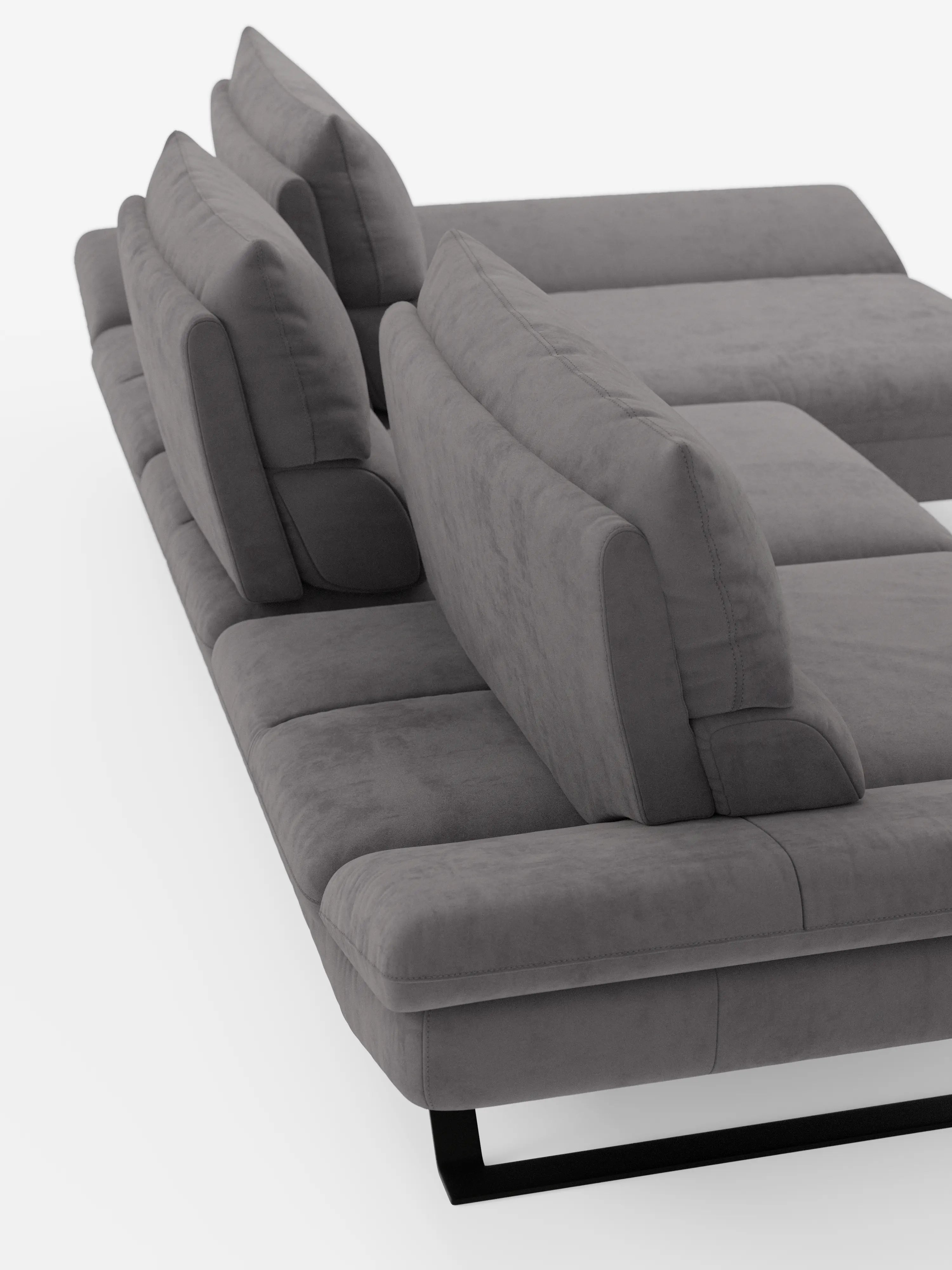 Moderno divano componibile Eclipse grigio con penisola e schienali regolabili, realizzato in microfibra tecnica antimacchia, ripreso da un’angolazione posteriore rialzata su sfondo bianco. Questo elegante divano angolare di Divani.Store presenta cuscini di seduta e schienale spessi, ampi braccioli e gambe basse in metallo nero, che conferiscono al divano un aspetto spazioso e contemporaneo.