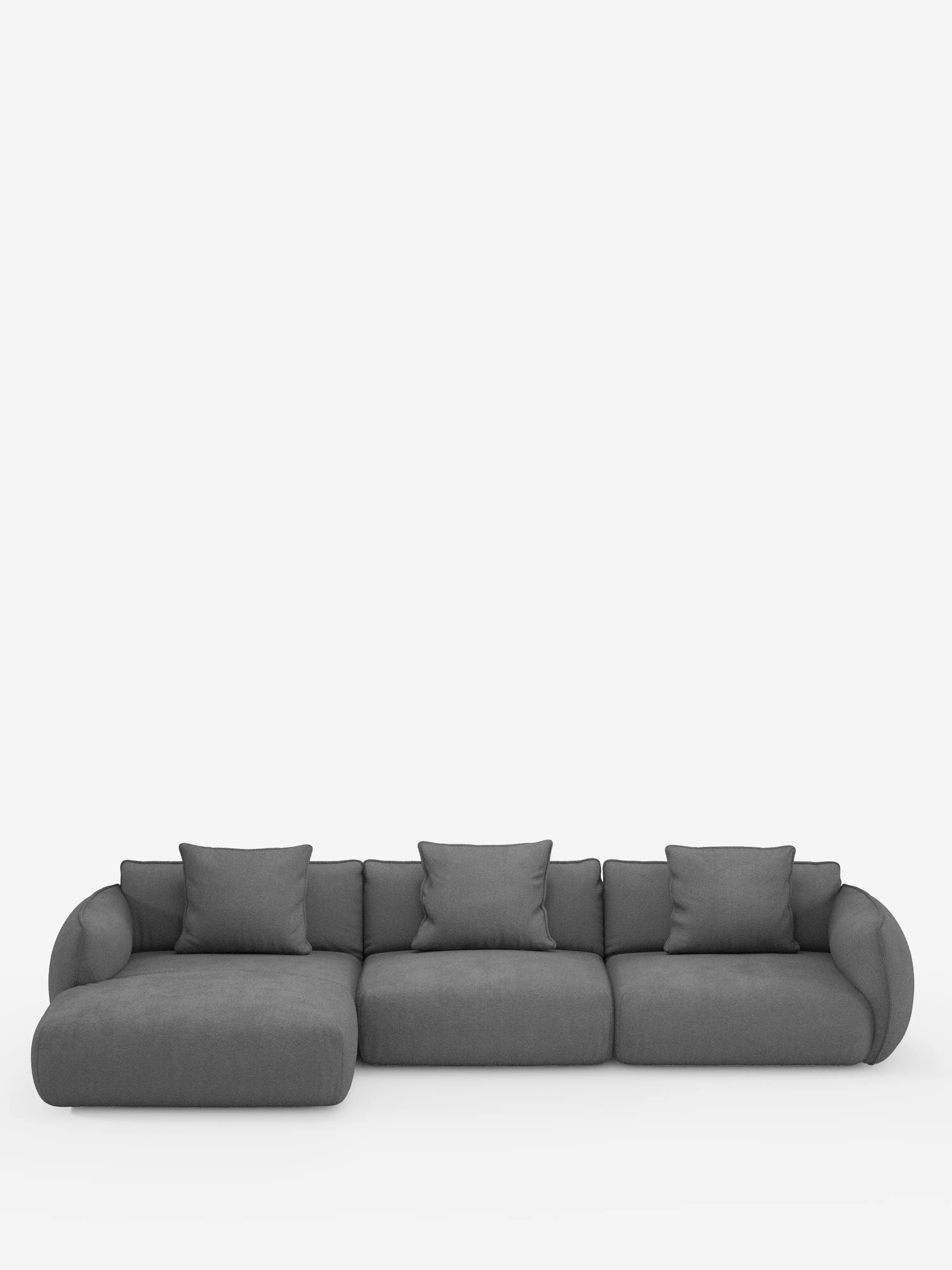 Un divano angolare contemporaneo della linea Nimbus con penisola componibile, realizzato in morbido tessuto effetto cotone smacchiabile T33 di Divani.Store, qui raffigurato in grigio scuro con tre posti principali e una chaise longue sulla sinistra. Questo divano moderno presenta braccioli arrotondati e cinque cuscini quadrati coordinati, il tutto su uno sfondo bianco a tinta unita.