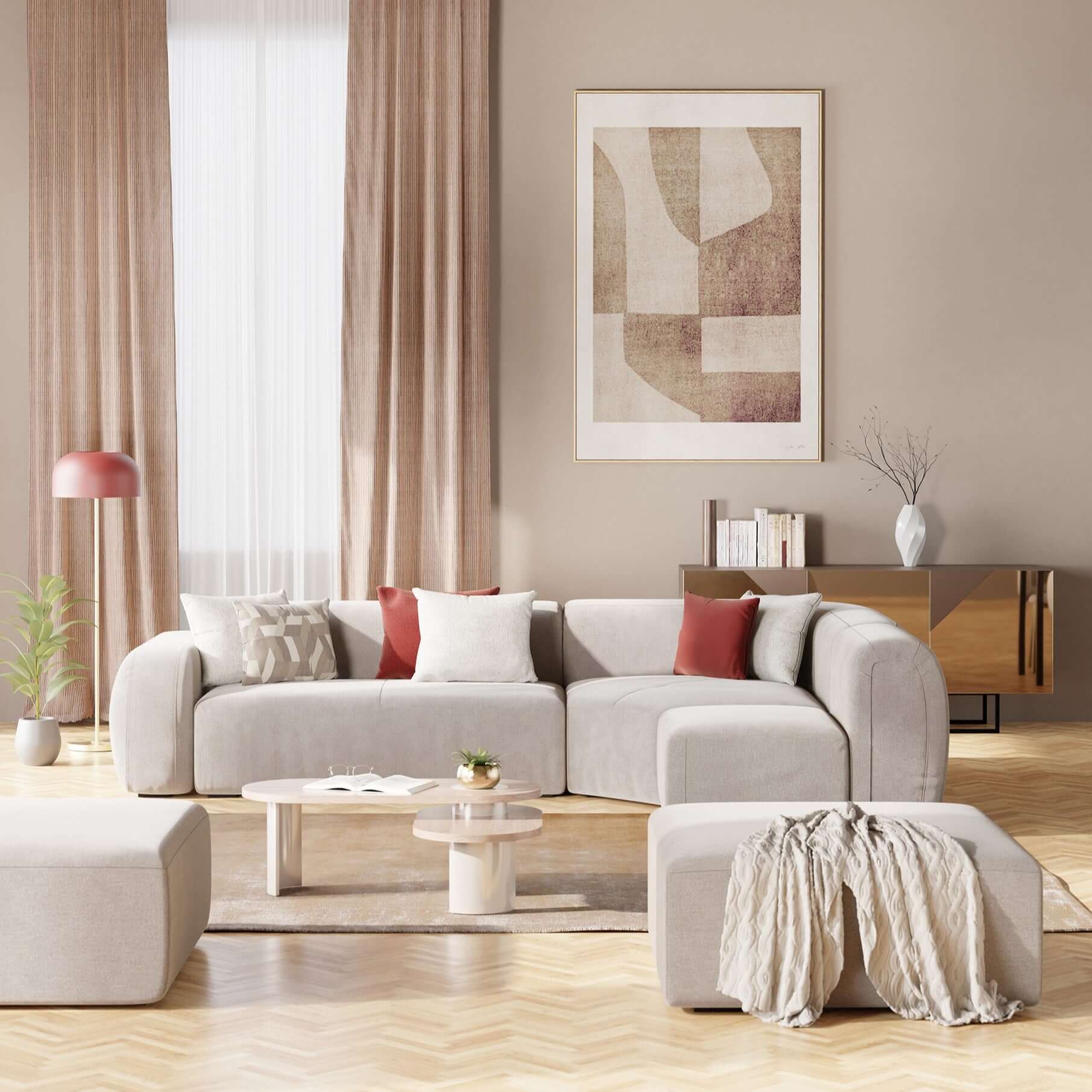 Un soggiorno moderno con il divano angolare componibile e modulare BonBon di Divani.Store in tessuto smacchiabile T23 panna, abbinato a cuscini bianchi e color ruggine, un paracolpi beige, un tavolino rotondo, tende abbronzate, una credenza in legno e opere d'arte astratte.