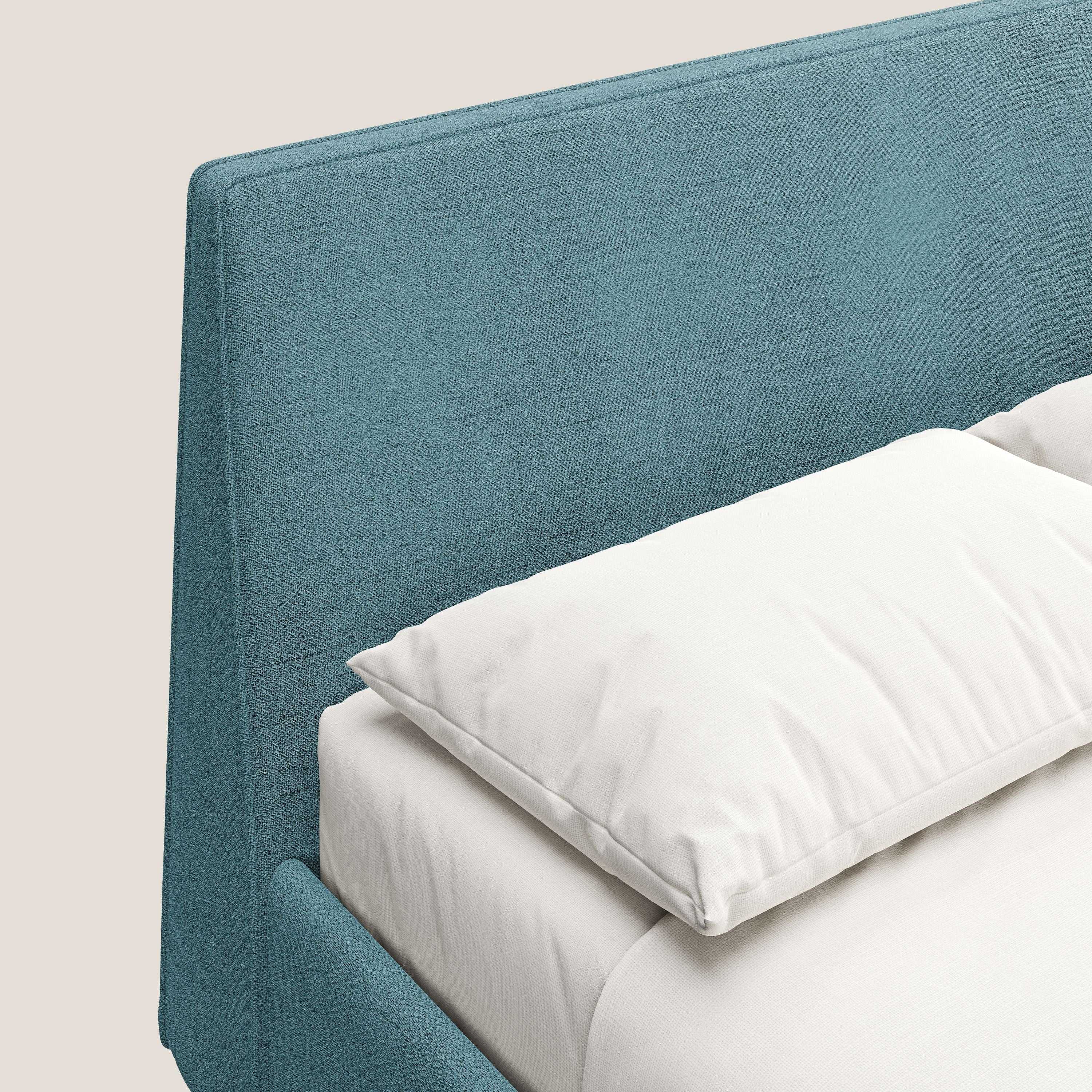 Justin letto imbottito contenitore e sfoderabile in tessuto fiammato impermeabile T03 azzurro - divani.store