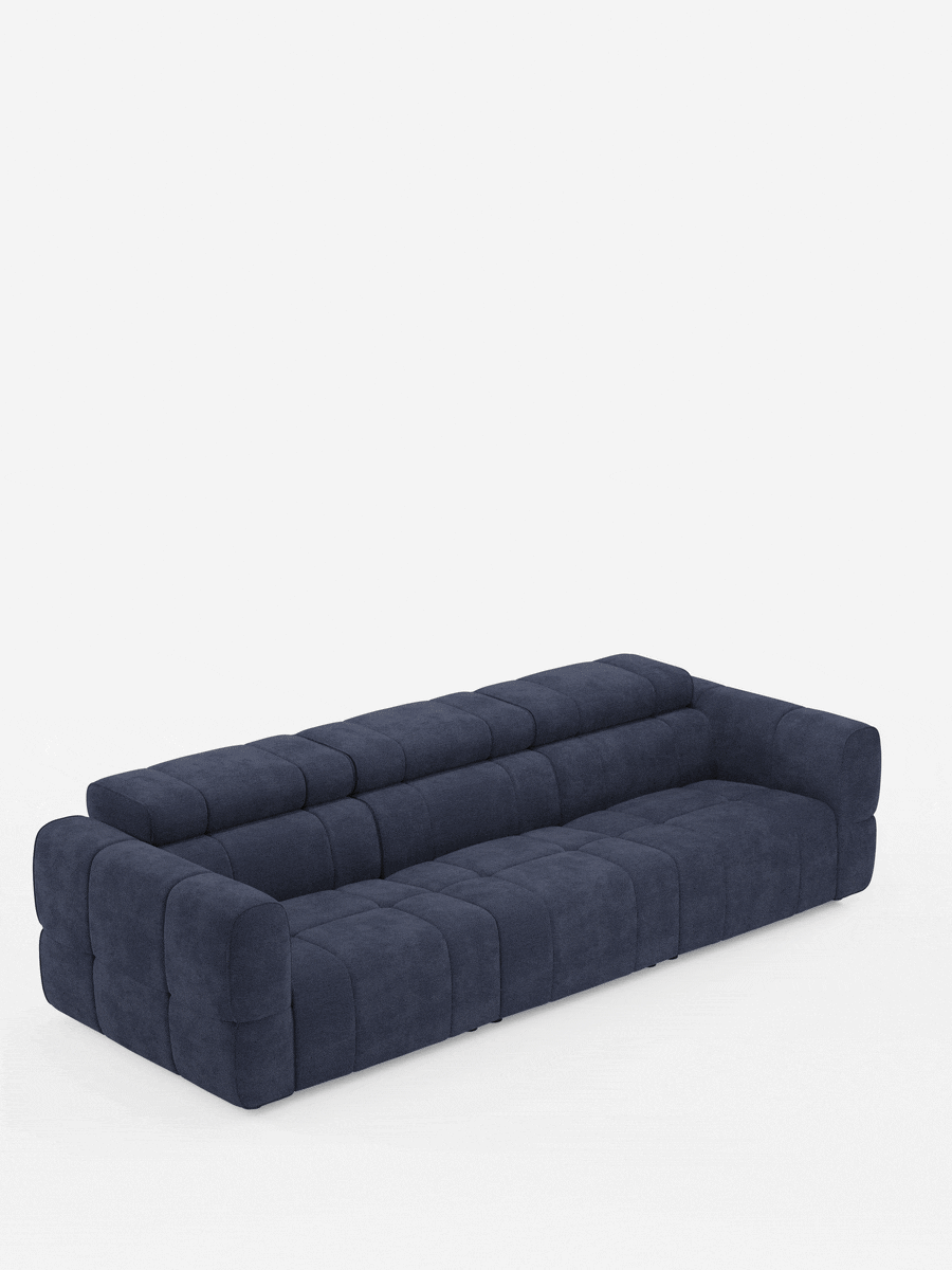 Un divano modulare Giotto blu scuro a 4 posti con poggiatesta reclinabili e funzione relax elettrica opzionale, rivestito in tessuto smacchiabile T23, caratterizzato da un design squadrato a quattro posti con imbottitura capitonné e cuciture rettangolari su sfondo bianco.