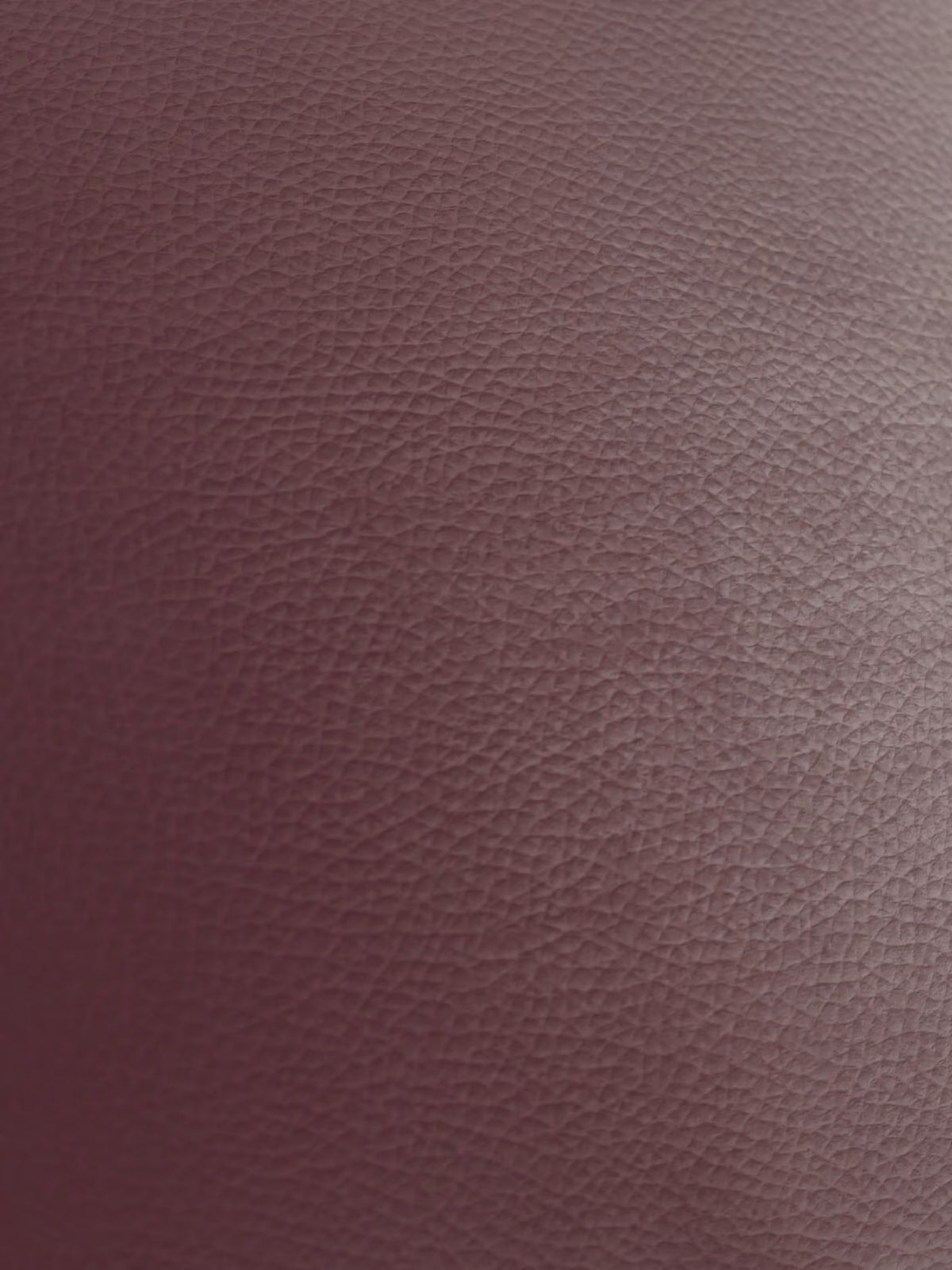 Primo piano di una superficie marrone rossiccio dalla texture particolare, realizzata in vera pelle spessorata con una grana fine dall’aspetto naturale e sottili sfumature che ne accentuano i ricchi contorni, evocando la sensazione di lusso del Chester – Divano Chesterfield in vera pelle spessorata a 2 e 3 posti di Divani.Store. Nell’immagine non sono visibili altri oggetti o dettagli.