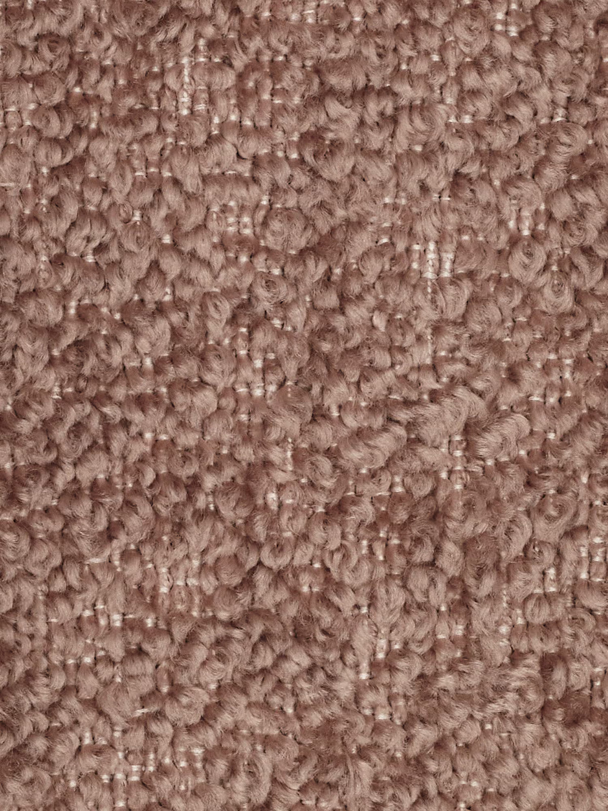 Primo piano di un tappeto a pelo riccio testurizzato, in una tonalità tenue di rosa. I riccioli formano una superficie morbida e irregolare con un delicato motivo a griglia. La fibra appare soffice e ben intrecciata, mettendo in risalto la consistenza densa e avvolgente del tappeto: una base accogliente per qualsiasi divano modulare o divano moderno come elemento centrale dell’arredamento.