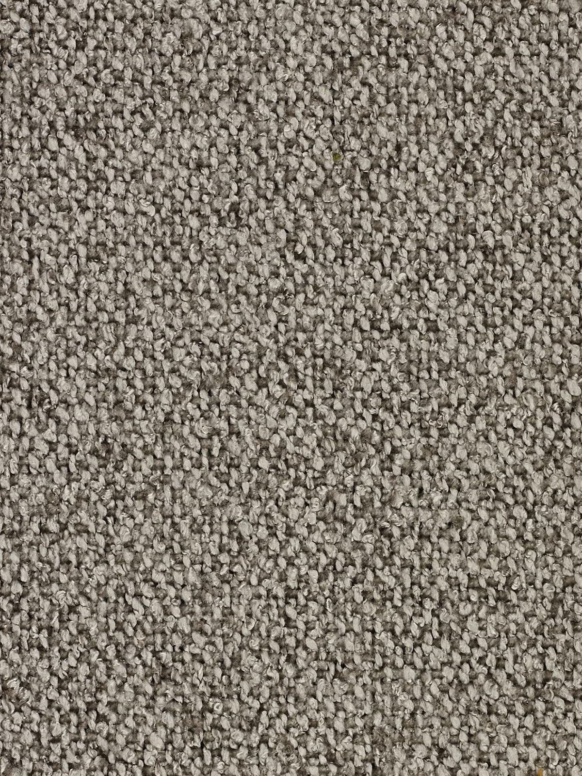 Primo piano di una moquette grigia con trama a riccioli, caratterizzata da fibre a riccioli fitti in varie tonalità di grigio e marrone chiaro. La superficie densa e uniforme mette in risalto l’intricata trama e l’aspetto morbido e imbottito caratteristico dei tappeti a riccioli: una base raffinata da abbinare al divano modulare a 3 posti Nimbus in morbido tessuto smacchiabile effetto cotone T33 di Divani.Store, che dona un tocco di eleganza contemporanea a qualsiasi interno moderno.