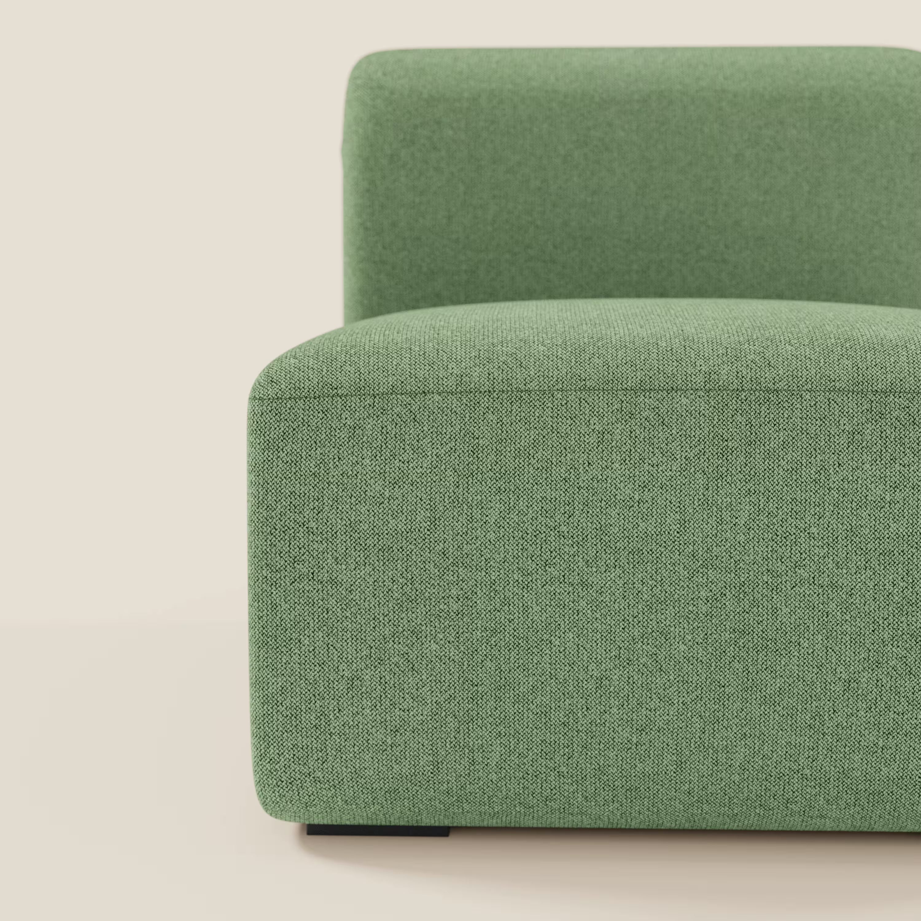 Il BonBon modulo centrale 70 cm di Divani.Store, una seduta moderna e minimalista in tessuto smacchiabile T23 menta, è presentato su uno sfondo beige chiaro. Di questo elemento componibile senza braccioli con rivestimento testurizzato è visibile solo la metà sinistra.