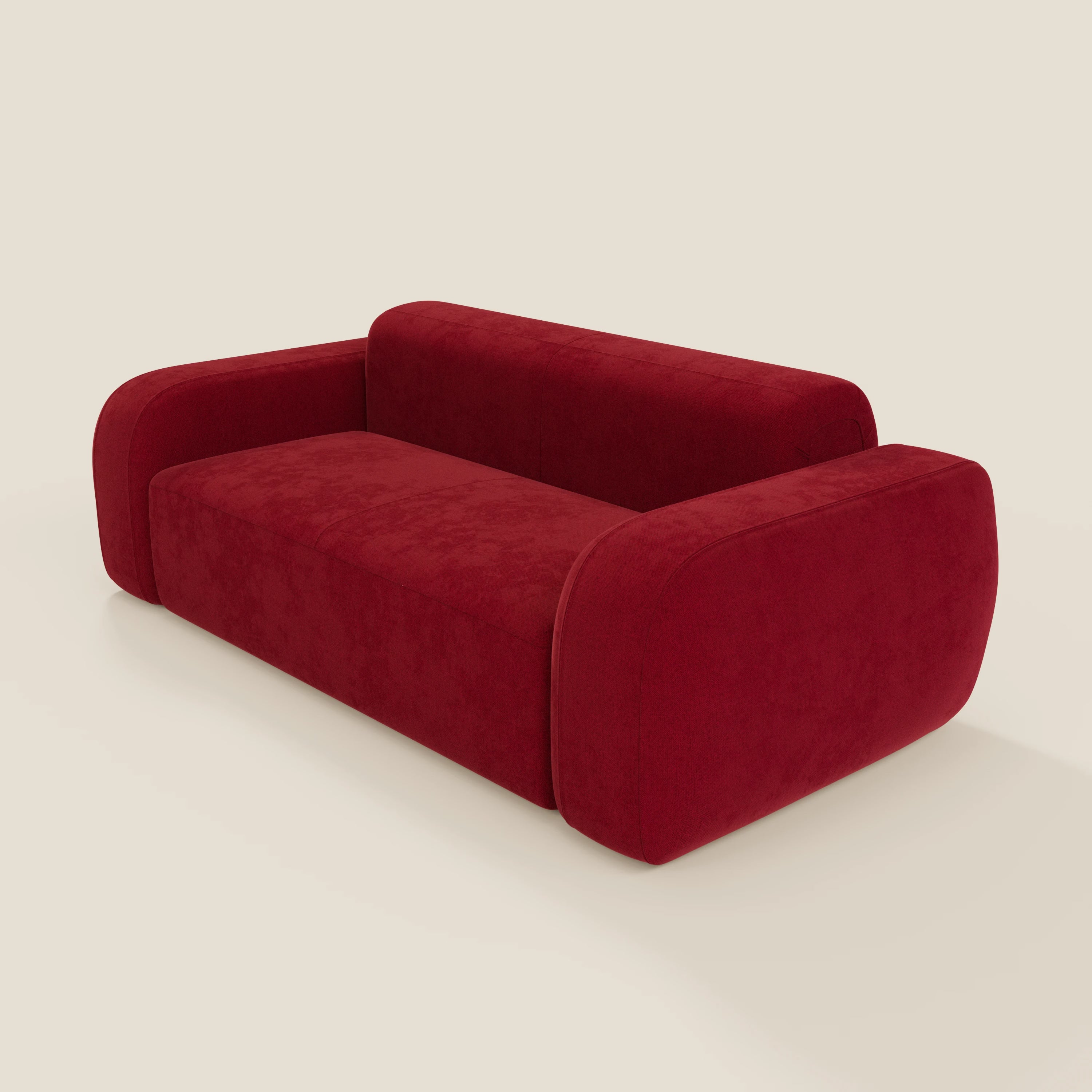 Il BonBon Divano modulare Lineare 220 di Divani.Store è un moderno divano in velluto bordeaux con braccioli e schienale arrotondati e sovradimensionati, caratterizzato da un design minimalista e squadrato, da un rivestimento liscio antimacchia (T23), da un aspetto senza cuciture e dall'assenza di gambe visibili.