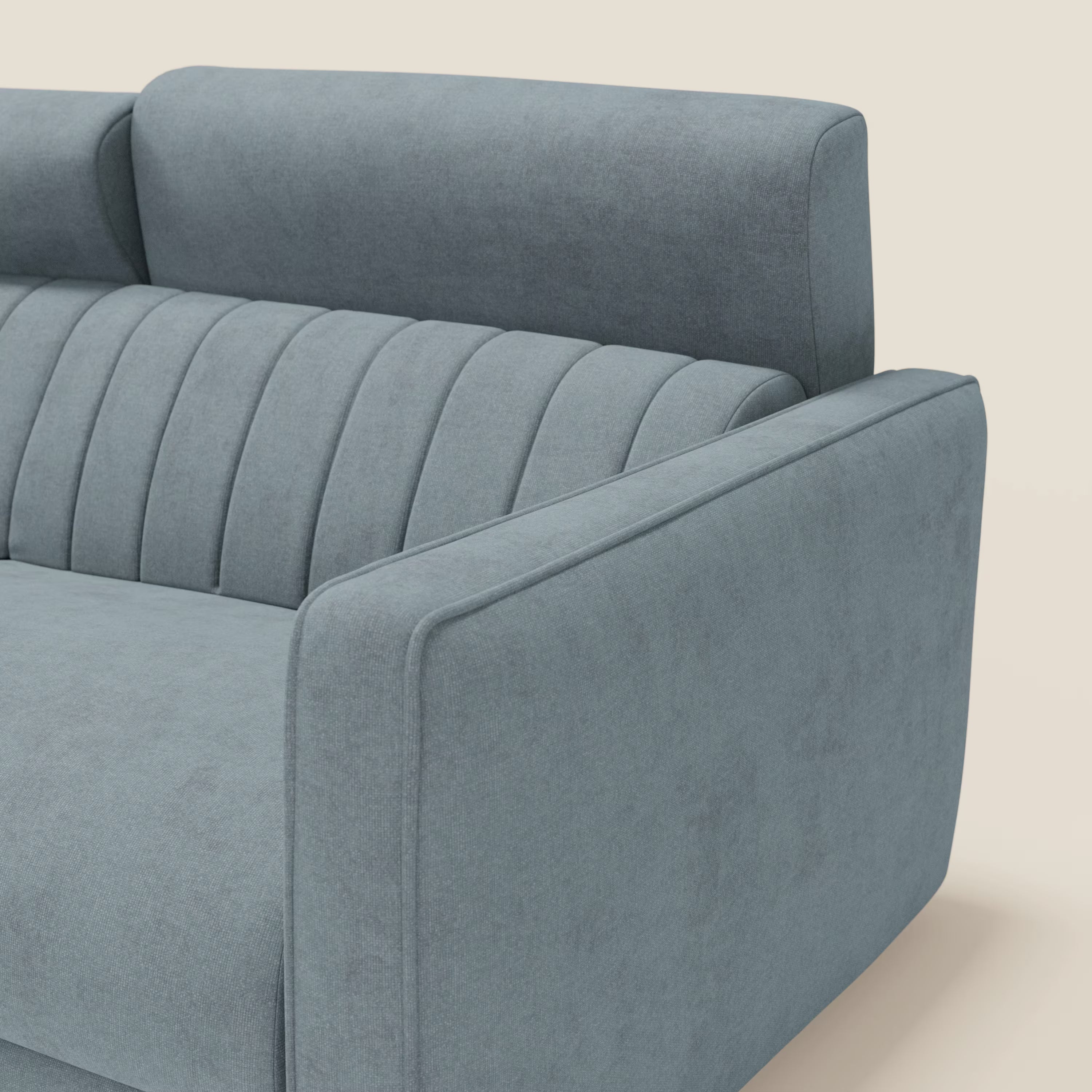 Primo piano del divano letto moderno Nivon di Divani.Store in tessuto impermeabile carta da zucchero, caratterizzato da schienale alto, ampi braccioli, materasso H16 cm e inserti verticali a canale per garantire comfort e stile su uno sfondo tinta unita.