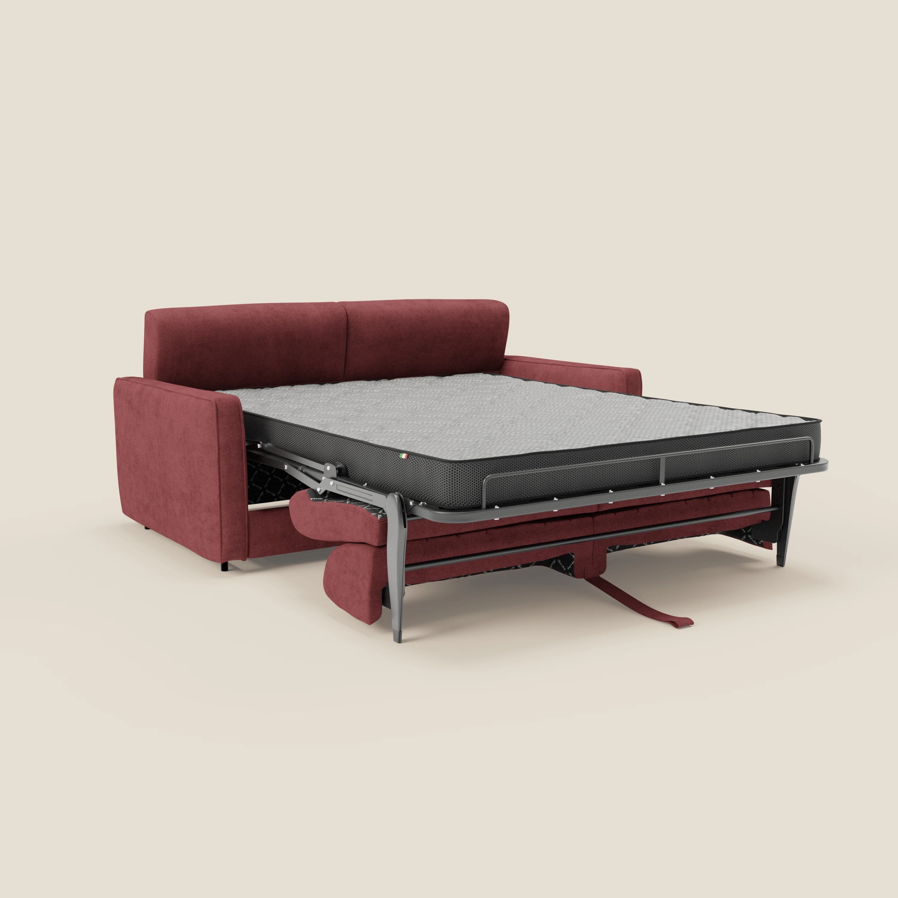 Il Nivon Divano letto moderno di Divani.Store è esposto con il materasso grigio H16 cm completamente esteso, sostenuto da una struttura in metallo. Il tessuto impermeabile rosso T25 e il poggiatesta regolabile ne evidenziano il comfort e la moderna versatilità.