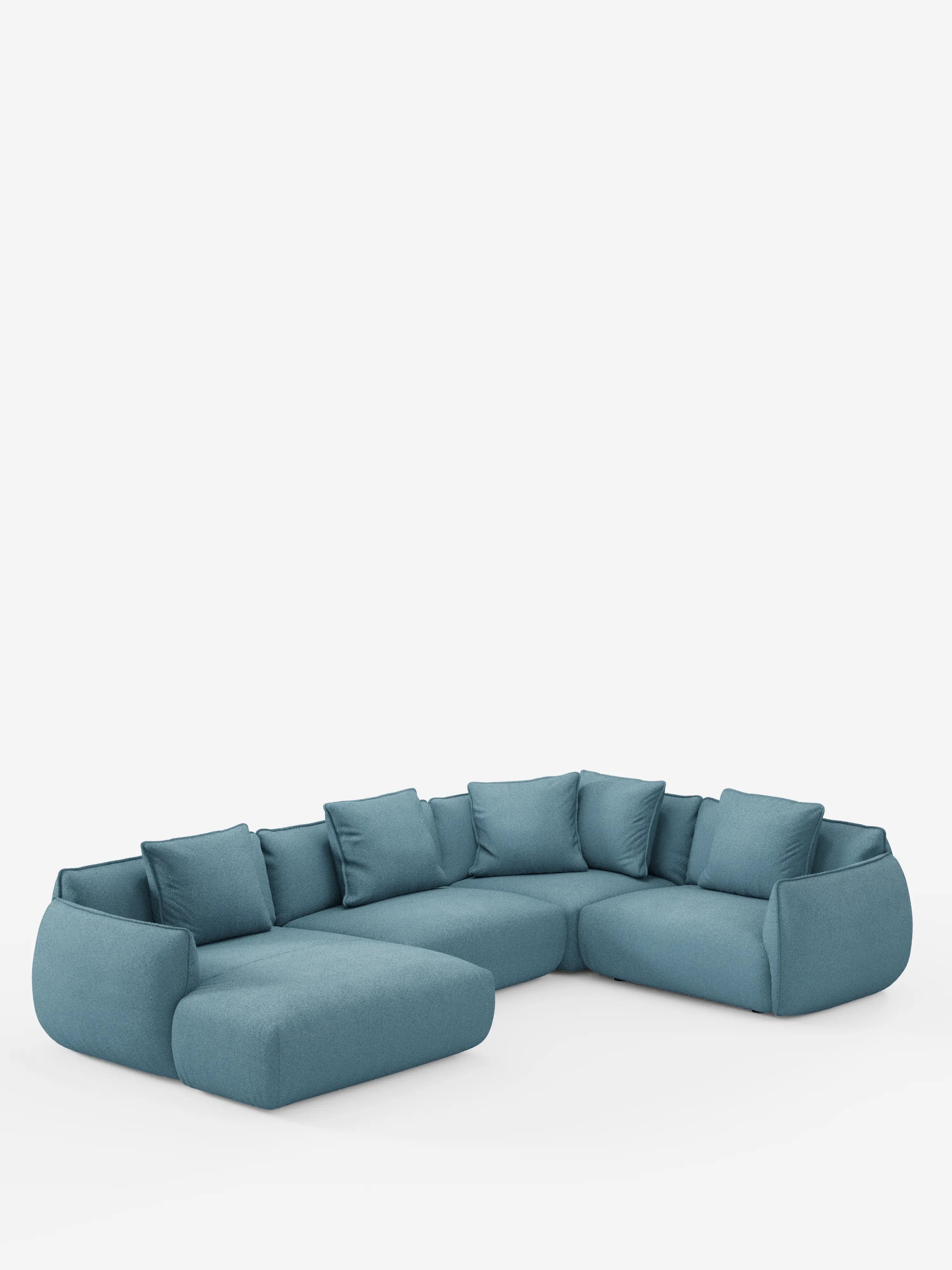 Un divano angolare panoramico componibile Nimbus in blu verde acqua, con penisola e angolo in tessuto antimacchia T33 di Divani.Store, è raffigurato su uno sfondo bianco. Questo divano modulare a L è caratterizzato da morbidi cuscini, sedute profonde e braccioli dal profilo basso, ed è corredato da numerosi cuscini decorativi coordinati che ne esaltano il comfort e lo stile. Realizzato in Italia, unisce un design moderno a un'eccezionale maestria artigianale.