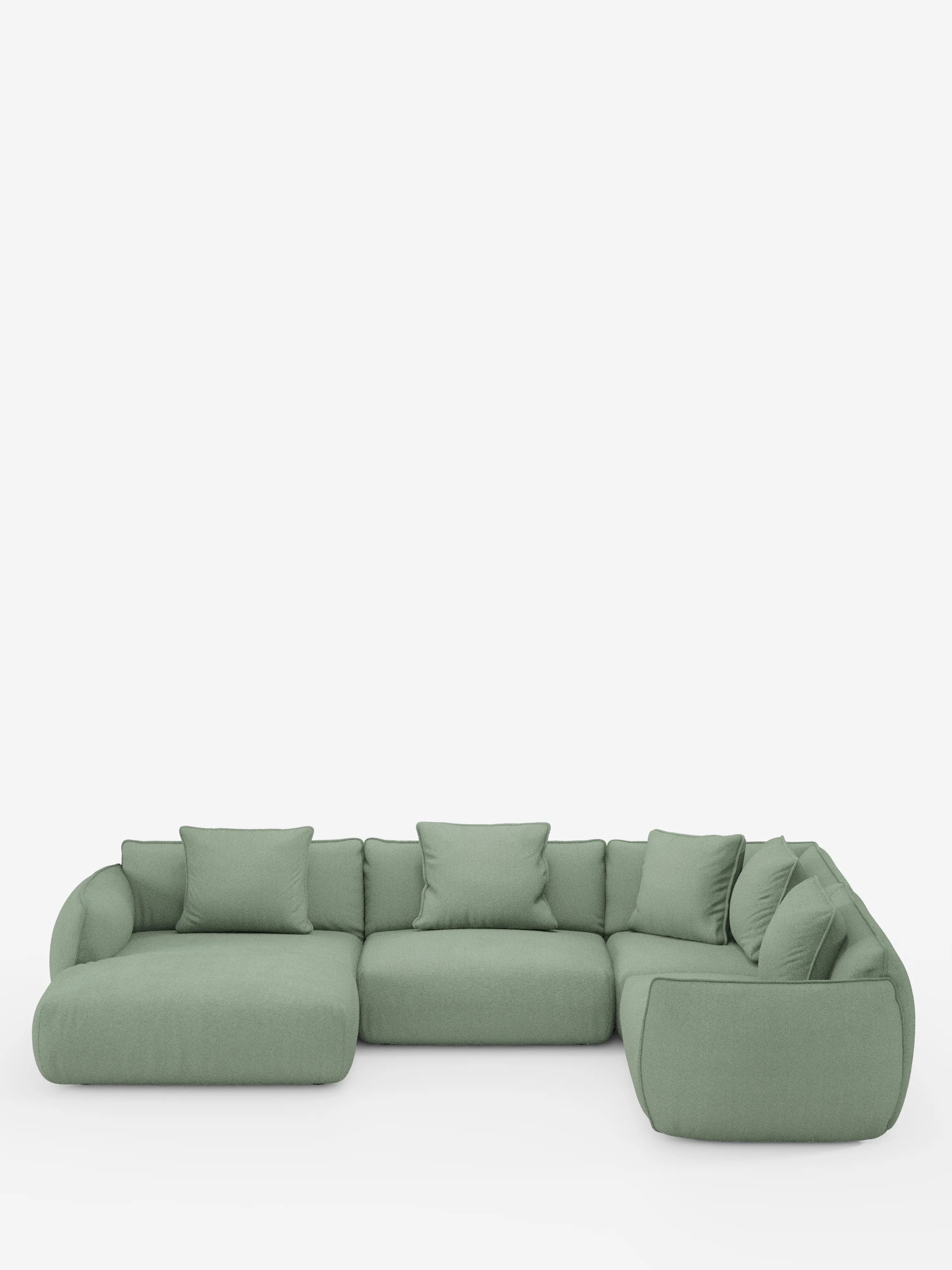 Viene presentato un ampio divano angolare panoramico componibile Nimbus color verde salvia con penisola e angolo, rivestito in tessuto smacchiabile T33 di Divani.Store, caratterizzato da un design a L con bordi morbidi e arrotondati e cuscini coordinati per lo schienale e i fianchi. Su uno sfondo bianco a tinta unita, questo moderno divano componibile unisce comfort e stile, rendendolo un elemento centrale ideale per qualsiasi soggiorno all'insegna del relax e dell'eleganza.