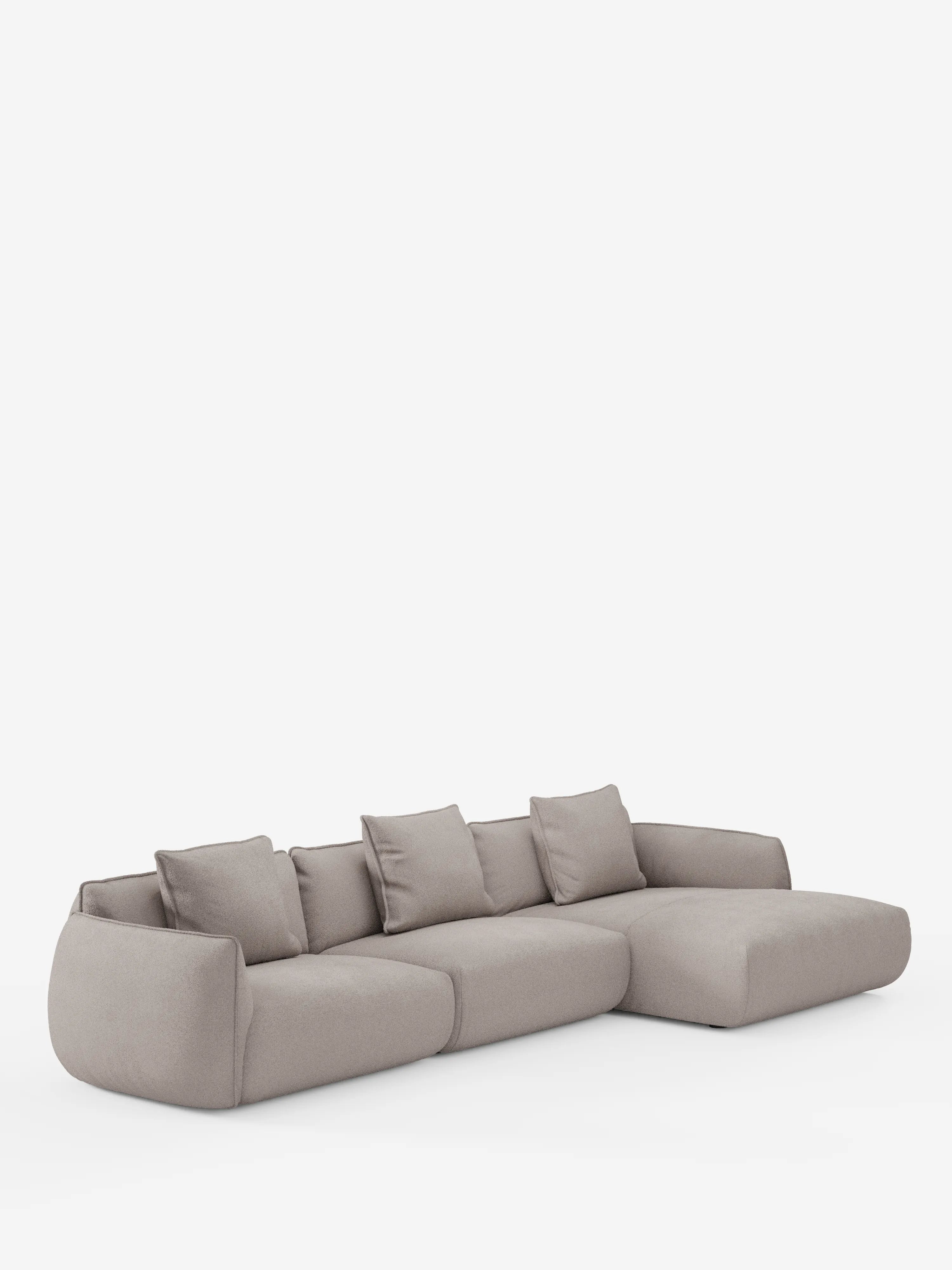 Il divano angolare con penisola componibile Nimbus in morbido tessuto effetto cotone smacchiabile T33 di Divani.Store è un divano componibile moderno, di colore grigio chiaro, dalle linee morbide e arrotondate. È dotato di quattro cuscini dello schienale e di una chaise longue sul lato destro. Il rivestimento sfoderabile è liscio e antimacchia, con una finitura effetto cotone, mentre il design minimalista risalta sullo sfondo bianco a tinta unita.