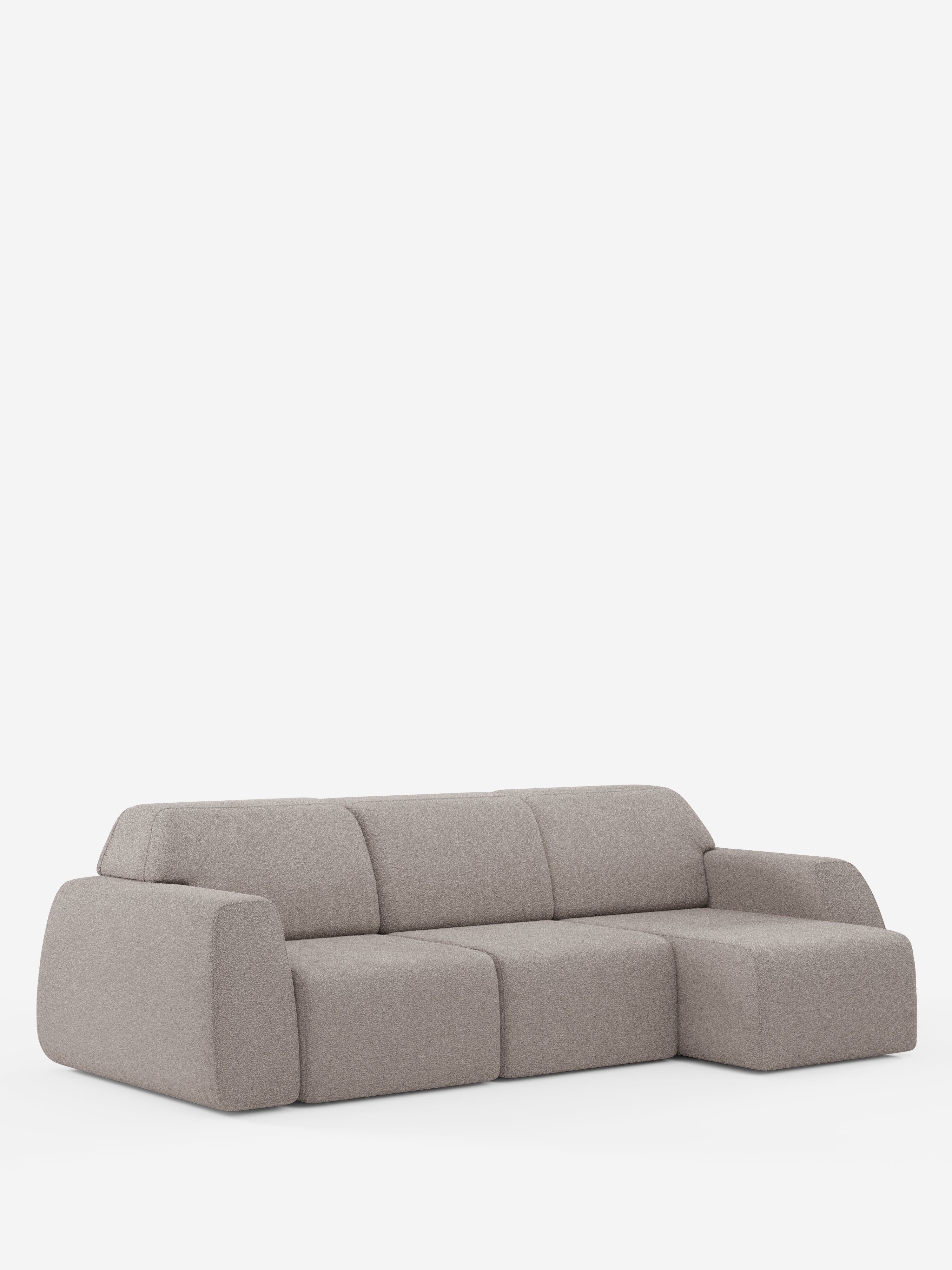 Un divano componibile contemporaneo di colore grigio chiaro, l’Orbit Divano angolare con penisola reversibile e tutte le sedute allungabili in tessuto smacchiabile effetto cotone T33 di Divani.Store, si caratterizza per i bordi arrotondati e morbidi e i cuscini soffici. Questo modello di alta gamma include una chaise longue reversibile ed è presentato su uno sfondo bianco a tinta unita.