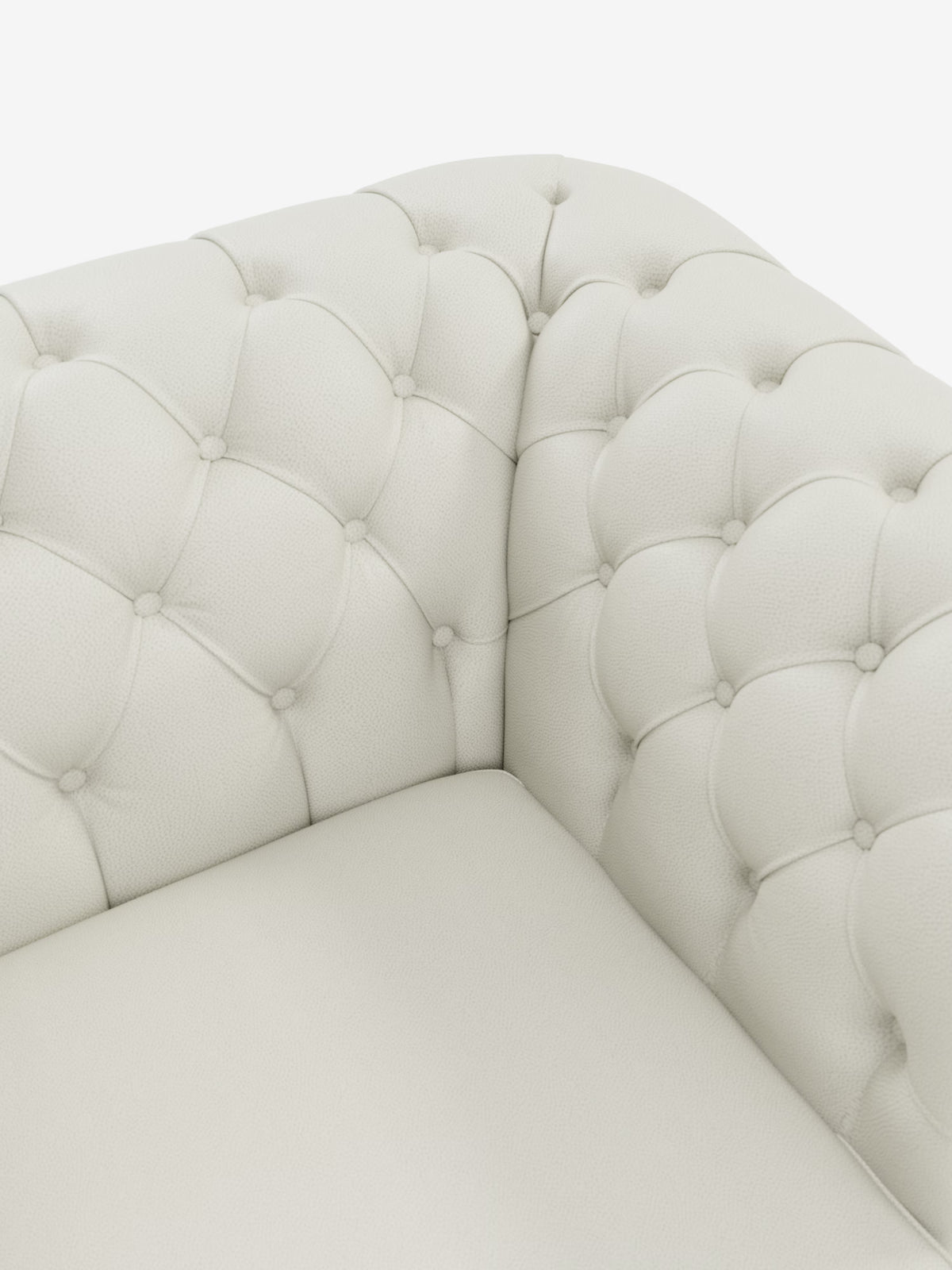 Primo piano del Chester 4 Posti 3 sedute in Vera Pelle – Chesterfield Capitonné Artigianale di Divani.Store, caratterizzato da un angolo in pelle color crema con trapuntatura a bottoni che mette in risalto la rifinitura dettagliata e la morbida imbottitura. La maestria artigianale è evidente nella trama della vera pelle e nelle precise cuciture del rivestimento, che sottolineano l’eleganza lussuosa e intramontabile del divano, ispirata al classico design Chesterfield.