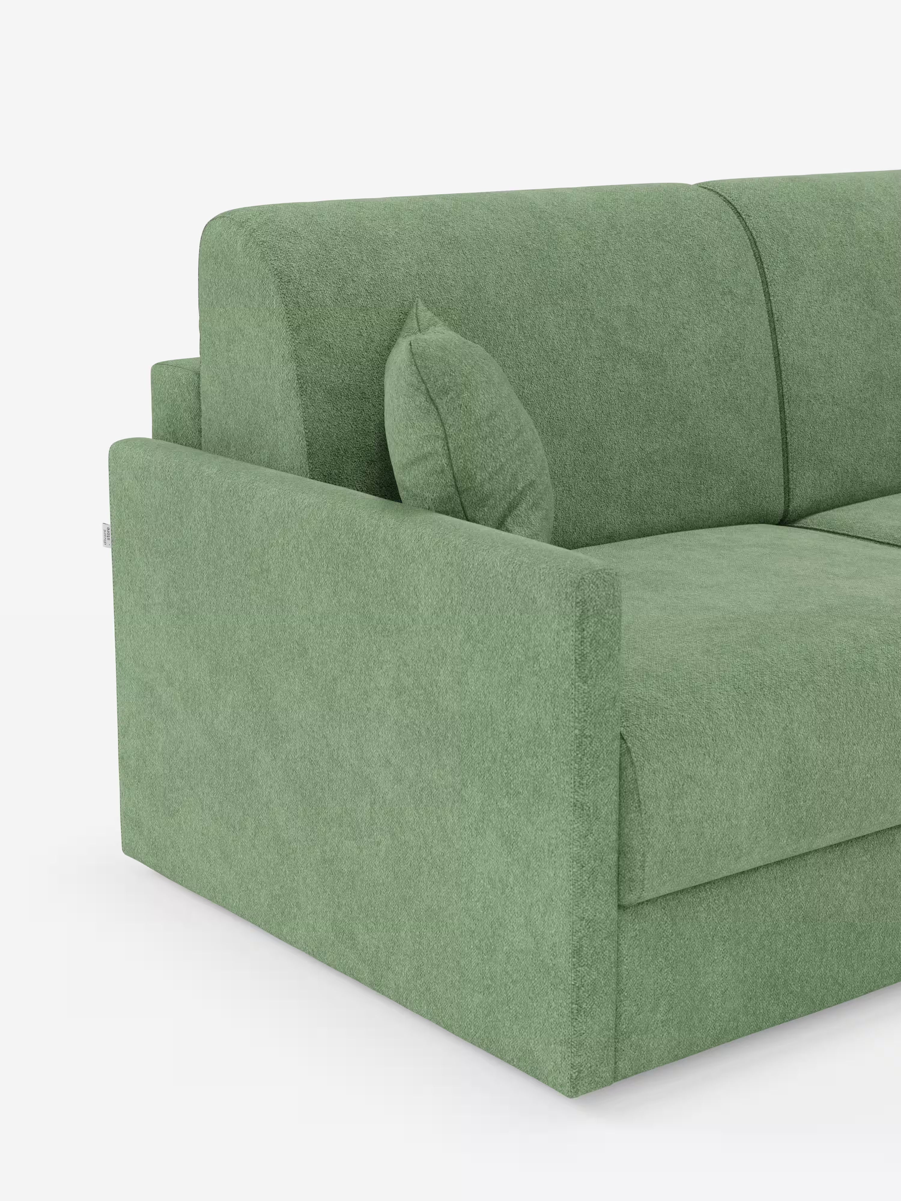 Viene presentato un elegante "Tommy Divano letto 2 e 3 posti matrimoniale" di Divani.Store, rivestito in tessuto T33 simile al cotone e facile da pulire, caratterizzato da braccioli squadrati e slanciati. Un cuscino verde abbinato è appoggiato sul lato sinistro. Lo sfondo bianco a tinta unita mette in risalto la morbida trama e il design minimalista del divano, ideale come divano con braccioli sottili per gli spazi abitativi contemporanei.