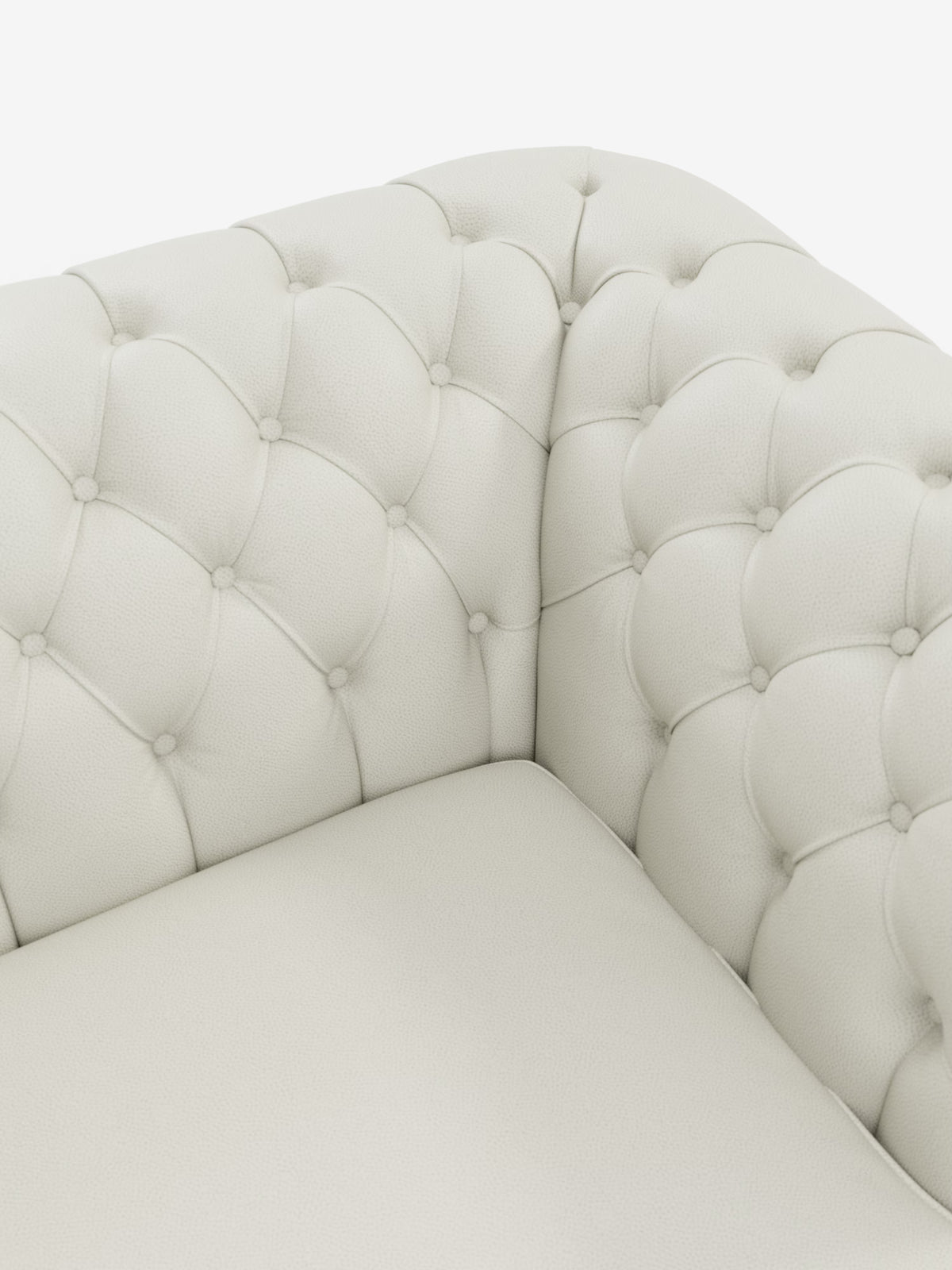 Primo piano di un divano ad angolo in pelle trapuntata color crema, con dettagli a bottoni a rombi sullo schienale e sui braccioli, che ne esaltano l’imbottitura morbida e l’eleganza senza tempo. Il Chester – Divano Chesterfield in vera pelle spessorata a 2 e 3 posti di Divani.Store presenta una superficie liscia e accogliente, incarnazione della raffinata maestria artigianale italiana.