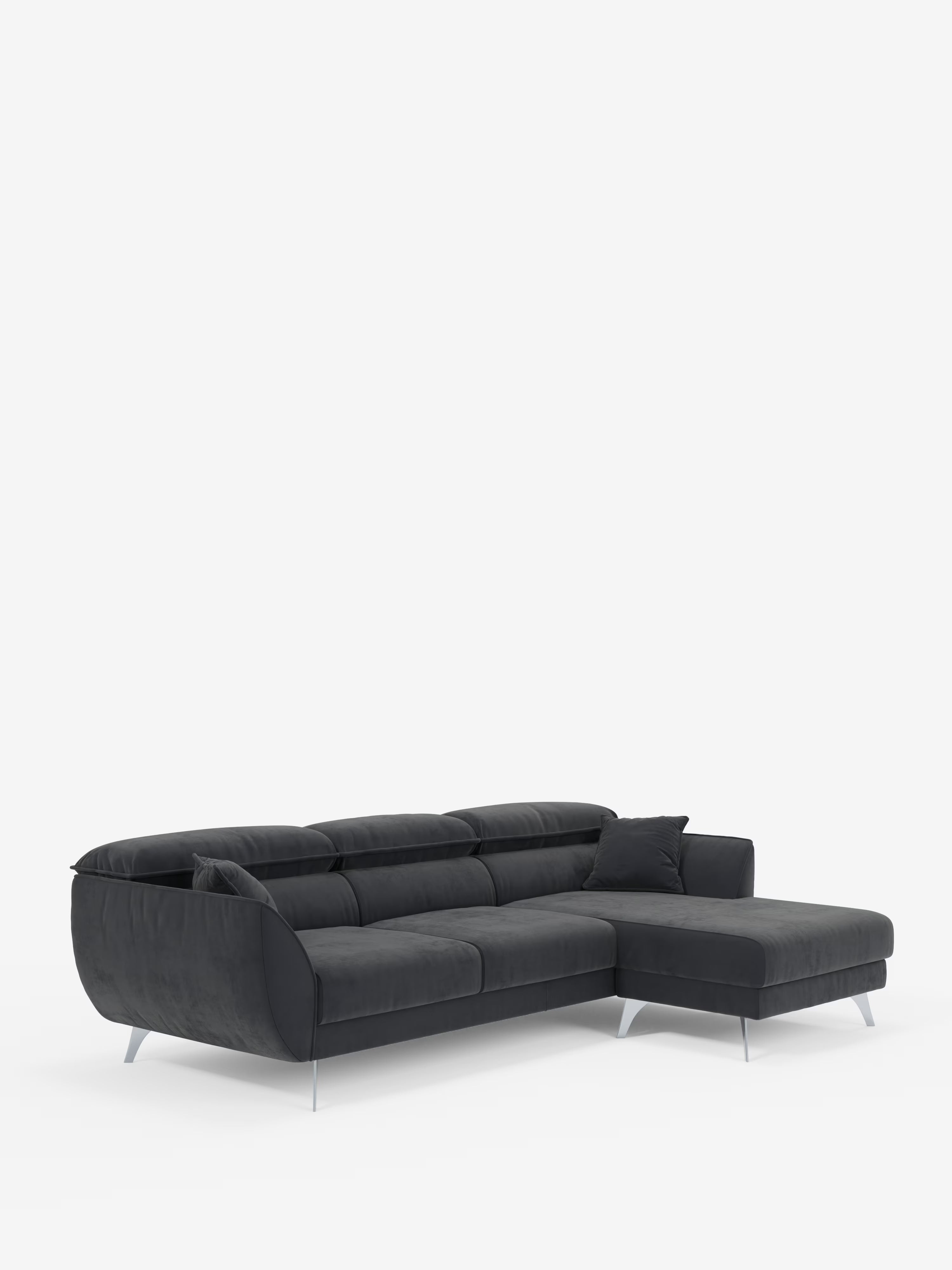Il divano angolare Michelangelo con penisola e sedute estensibili di Divani.Si tratta di un moderno divano componibile grigio scuro con chaise longue sul lato destro, gambe argentate, morbidi cuscini, un cuscino decorativo abbinato e poggiatesta regolabili, il tutto rivestito in elegante tessuto T30 effetto velluto resistente alle macchie, il tutto presentato su uno sfondo bianco a tinta unita.