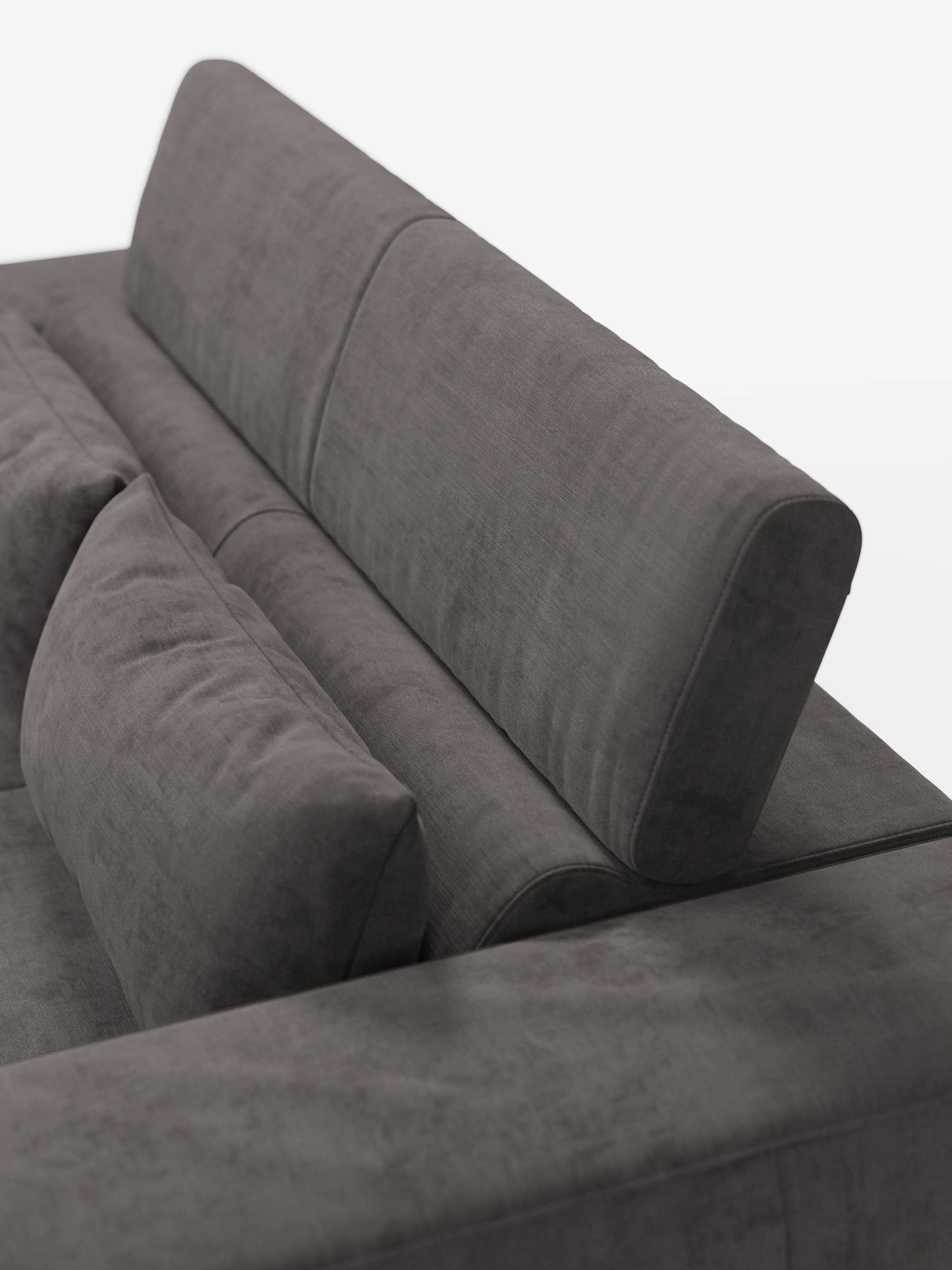 Primo piano del divano Monarch con funzione relax elettrica di Divani.Store, realizzato in morbido tessuto T31 grigio scuro resistente alle macchie, caratterizzato da cuscini soffici, schienale inclinato e un cuscino lombare aggiuntivo. Il rivestimento liscio e il design minimalista risaltano su uno sfondo bianco uniforme, con solo una parte del divano visibile.