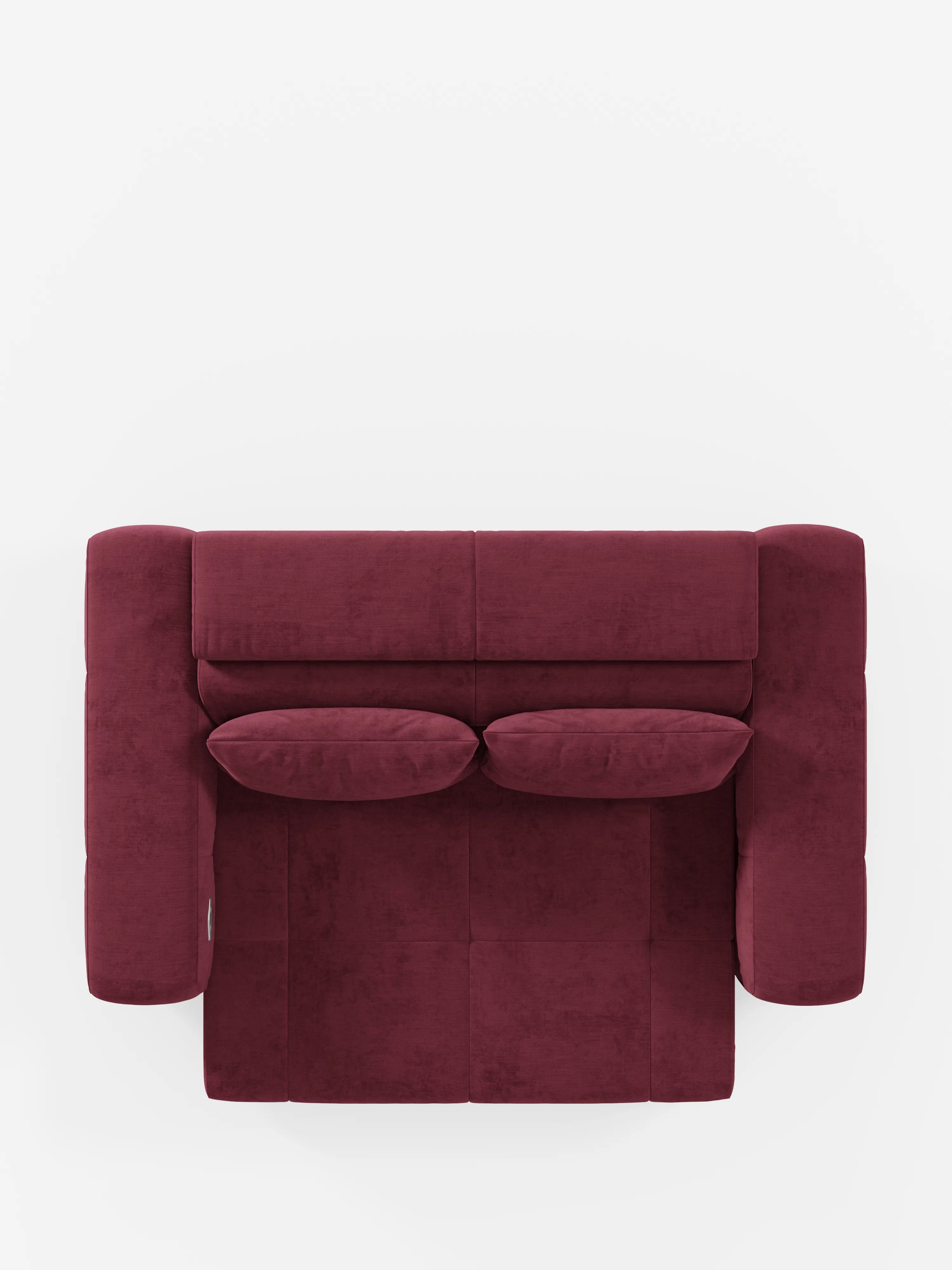 Una vista dall'alto del divano Monarch con funzione relax elettrica per l'allungamento delle sedute e poggiatesta reclinabile di Divani.Store, rivestito in tessuto T31 color bordeaux, morbido e facile da pulire, con due cuscini coordinati. Il moderno design squadrato è caratterizzato da ampi braccioli e da una seduta imbottita, che cattura l’essenza di un divano contemporaneo per un look pulito e accogliente su uno sfondo bianco.
