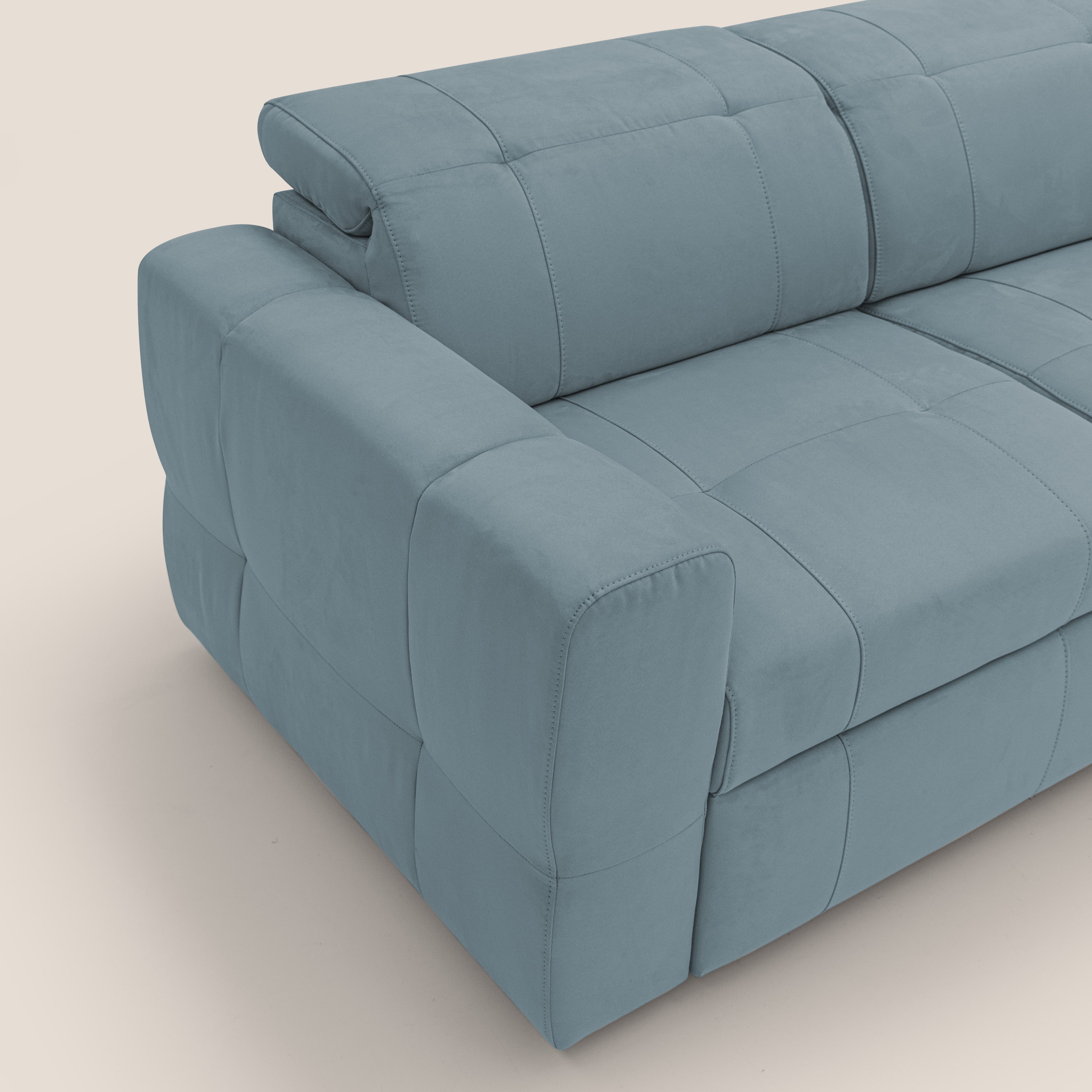 Kronos Divano angolare con poggiapiedi estraibile e pouf contenitore mobile in microfibra impermeabile T11 carta da zucchero - divani.store