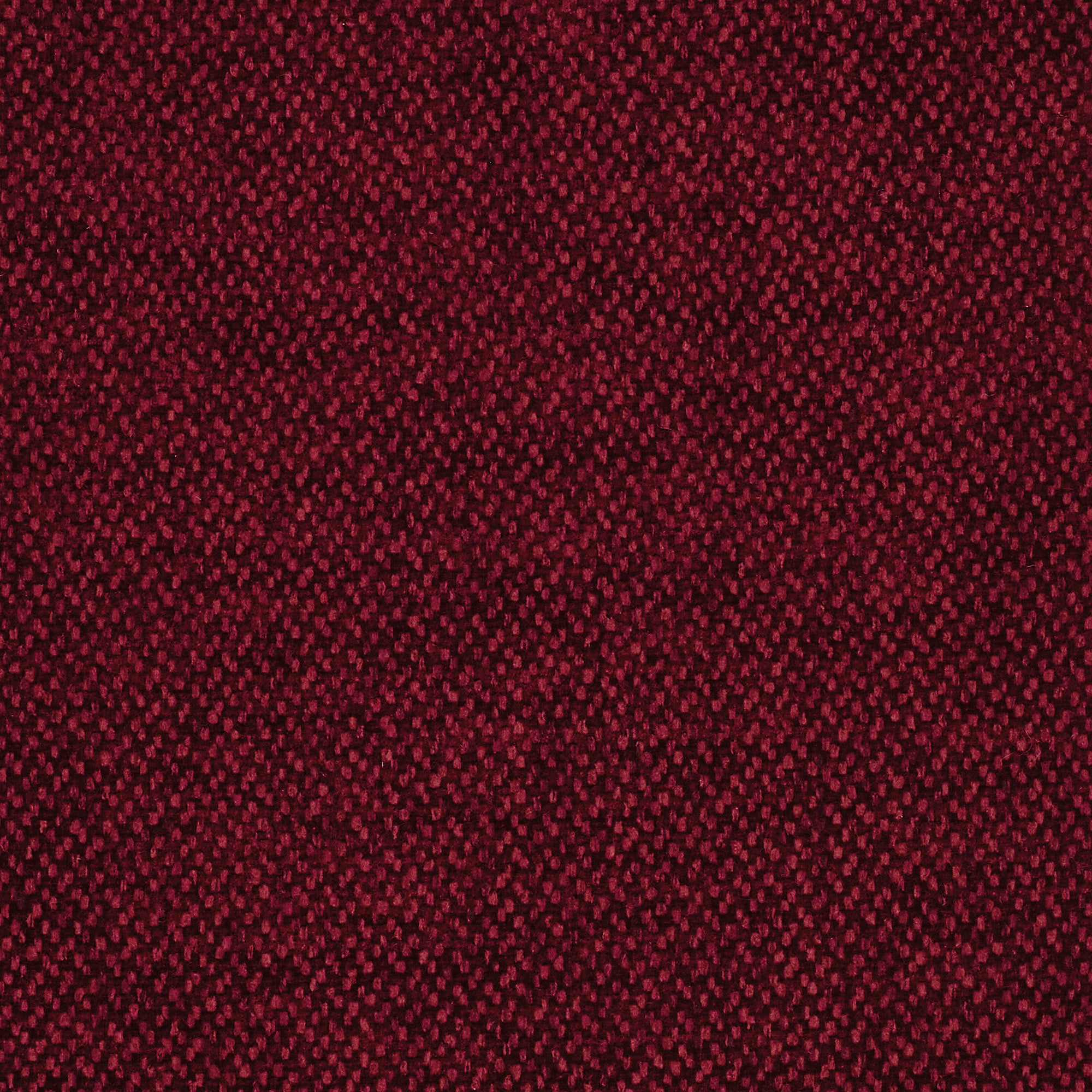 Un primo piano della Personalizzazione di Divani.Store in T23 mostra un morbido tessuto rosso con un fitto motivo a piccoli punti. Le sfumature di rosso scuro e bordeaux creano un disegno sottile e uniforme e una texture vellutata su tutta la superficie.