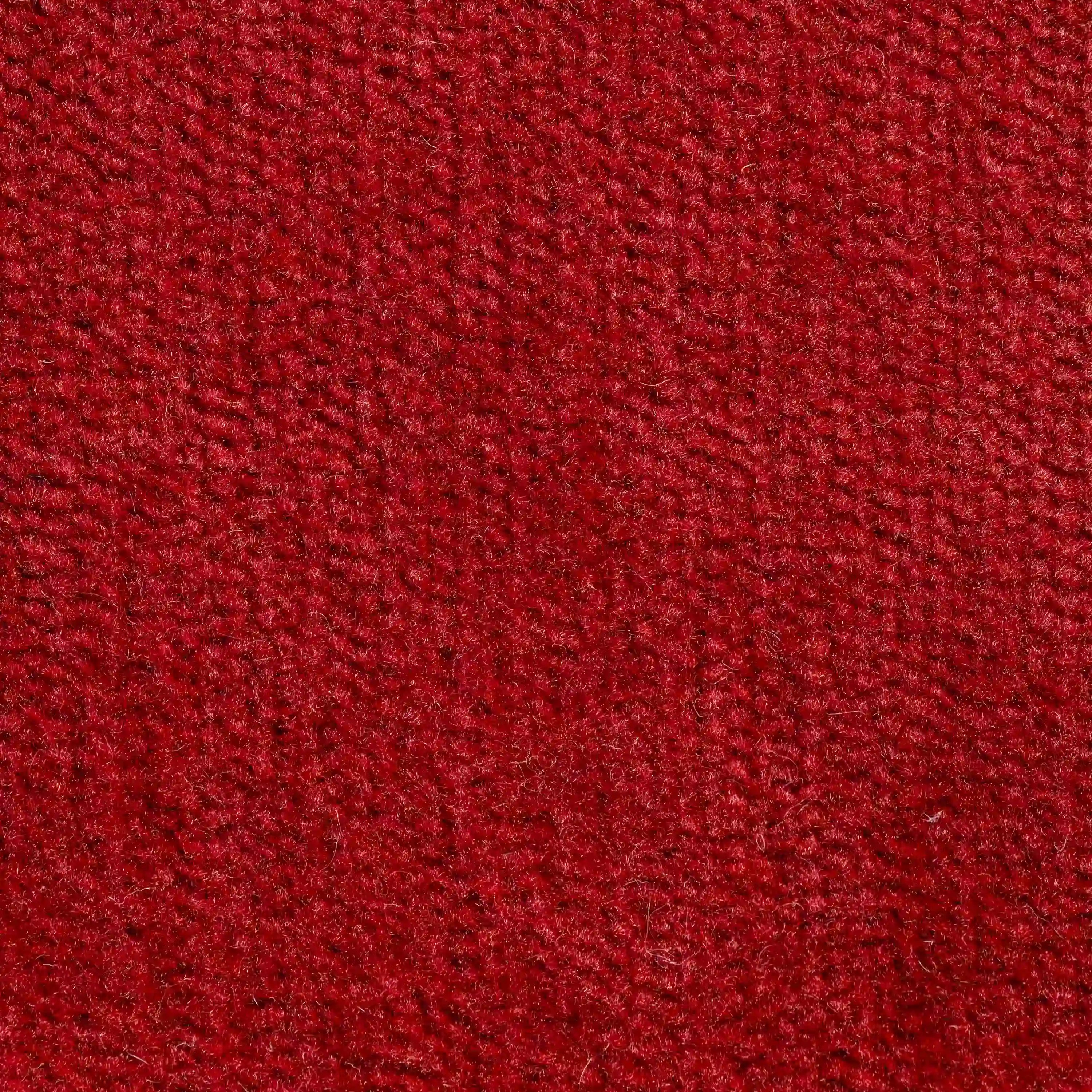 Primo piano del Bolero cuscino di Divani.Store in rosso intenso: il tessuto T31, smacchiabile e impermeabile, è morbido al tatto e presenta una trama di piccole fibre in rilievo. Disponibile in vari colori e resistente al restringimento.