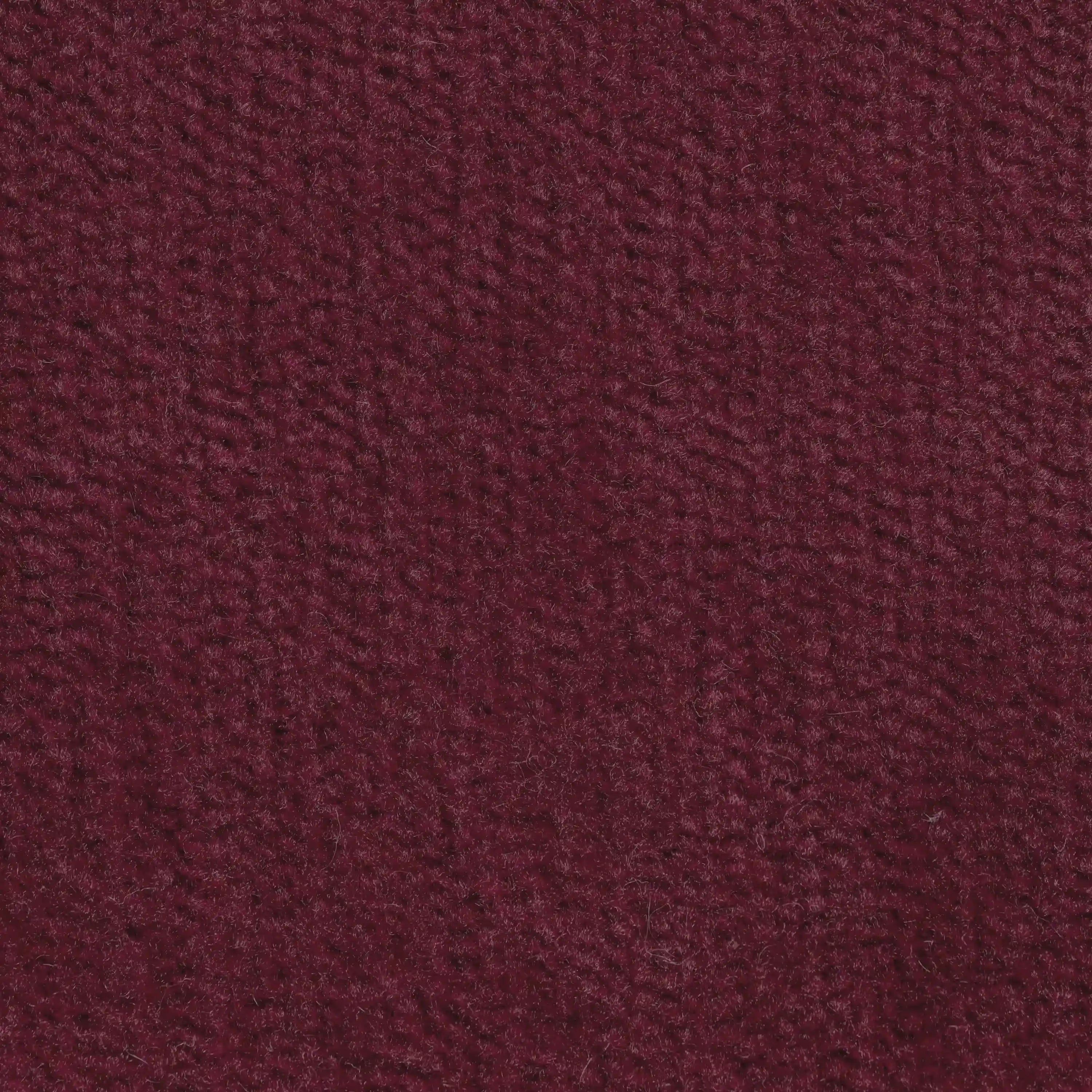 Primo piano del cuscino Bolero di Divani.Store, in tessuto T31 bordeaux intenso, morbido, antimacchia, impermeabile e non restringente. Il suo sottile motivo intrecciato aggiunge calore e stile; disponibile in vari colori.
