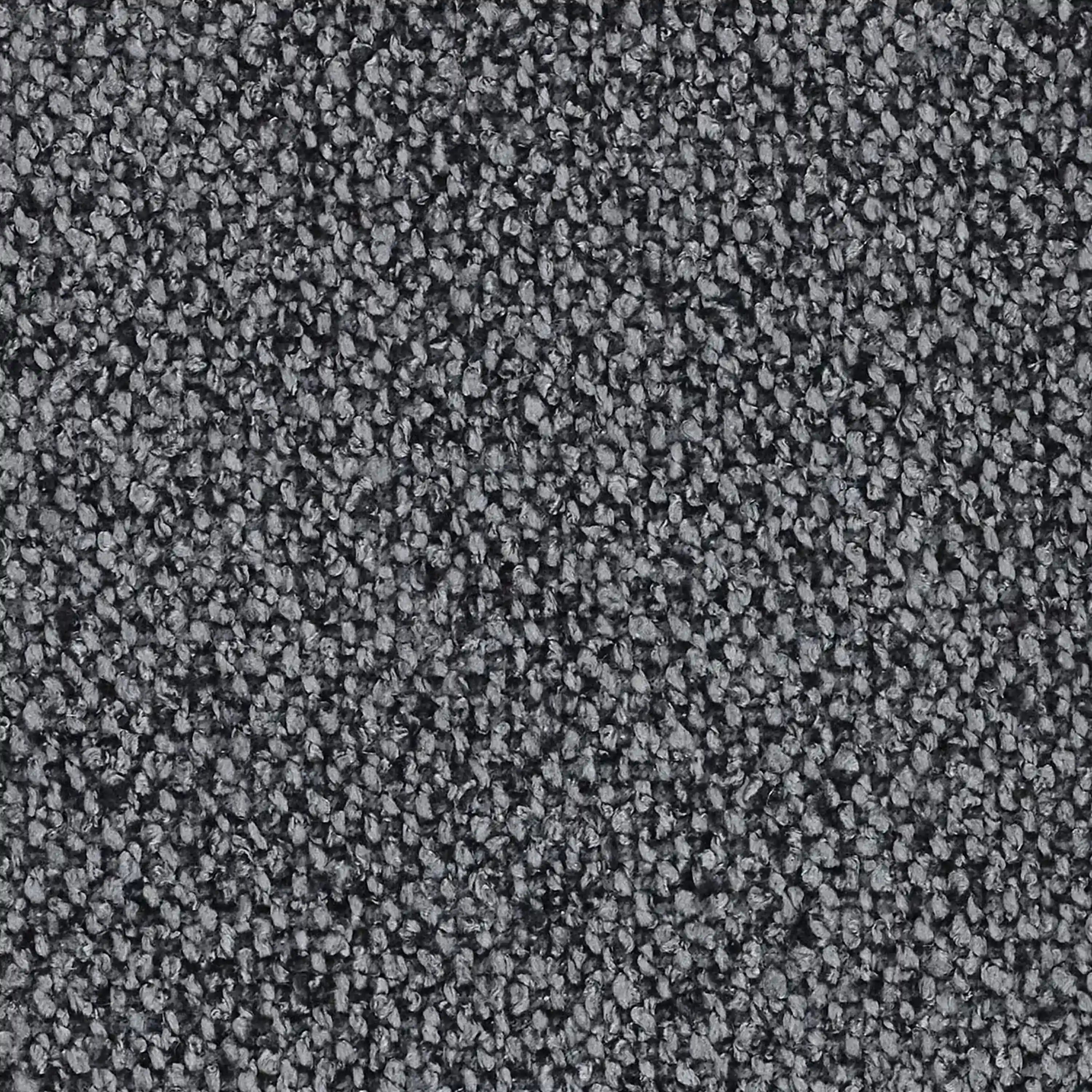 Primo piano di un tappeto morbido e grigio scuro con fibre fitte e piccole, che fa da sfondo ideale al divano angolare Nimbus con penisola componibile in morbido tessuto effetto cotone smacchiabile T33 di Divani.Store, sottolineandone la moderna eleganza.