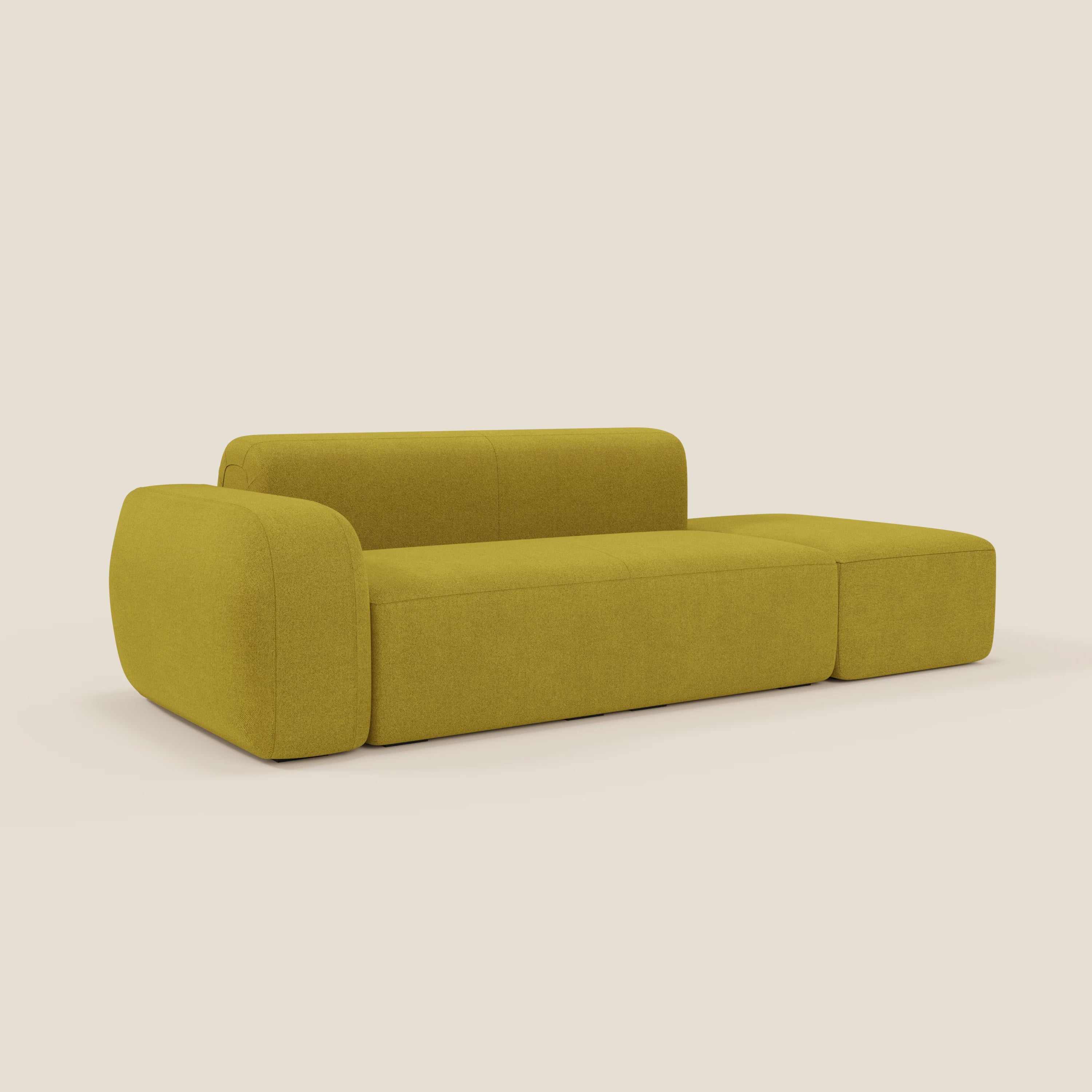 Il divano componibile BonBon Divani.Store in tessuto smacchiabile T23 giallo sole presenta un look moderno con braccioli arrotondati, schienale basso e spessa seduta imbottita, su uno sfondo bianco sporco.