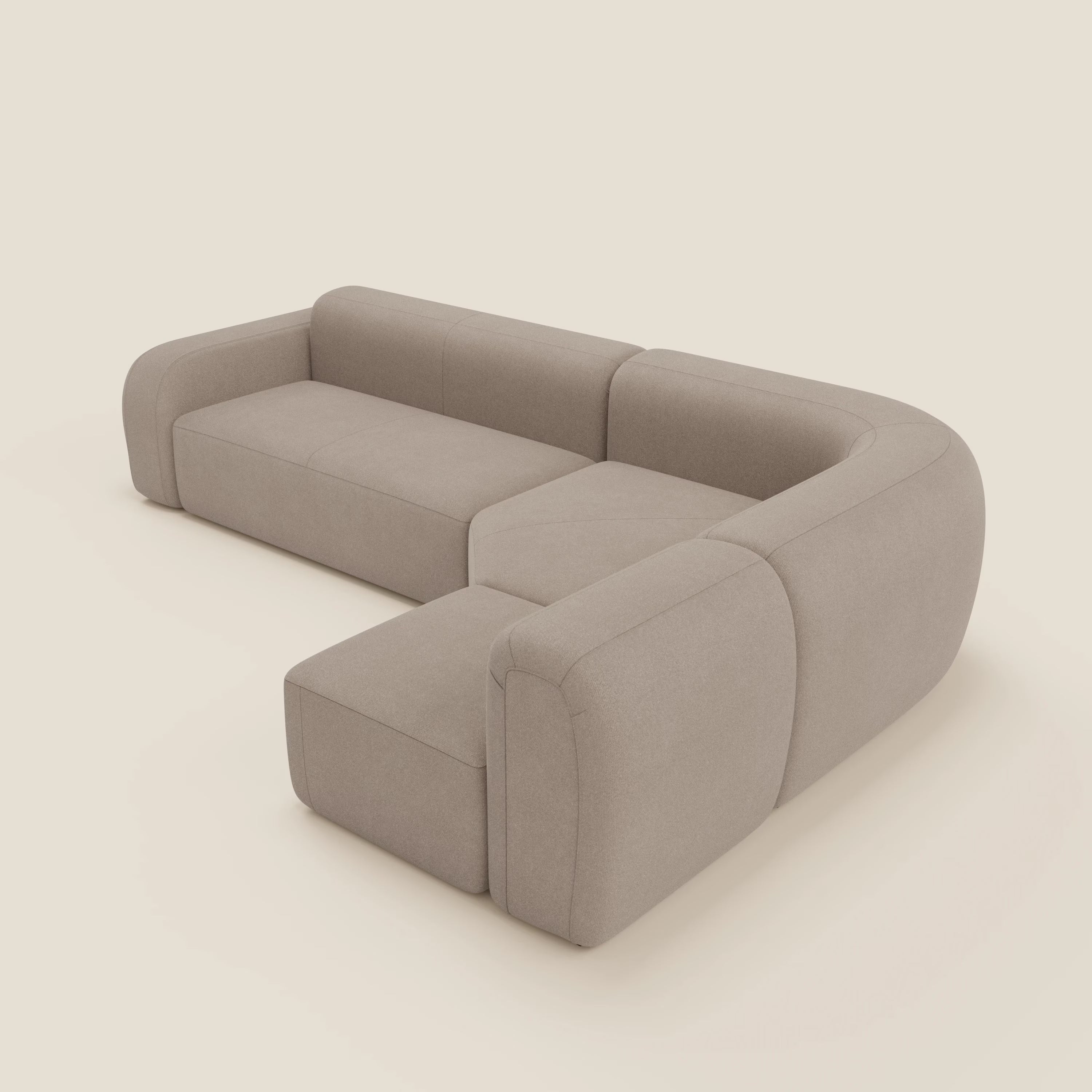 Il divano angolare componibile e modulare BonBon di Divani.Store, in tessuto smacchiabile T23 tortora, è caratterizzato da ampi braccioli, morbidi cuscini e un moderno design a basso profilo evidenziato dal suo look minimalista e senza cuciture.